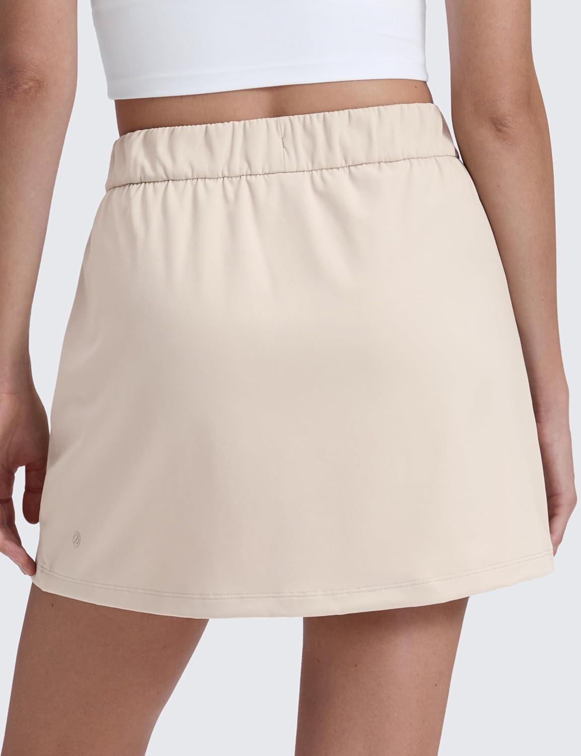 imageCRZ YOGA 4Way Stretch A Line Skirts for Women High Waitsted Mini Lined Tennis Work Drawstring Skort with PocketsMojave Tan