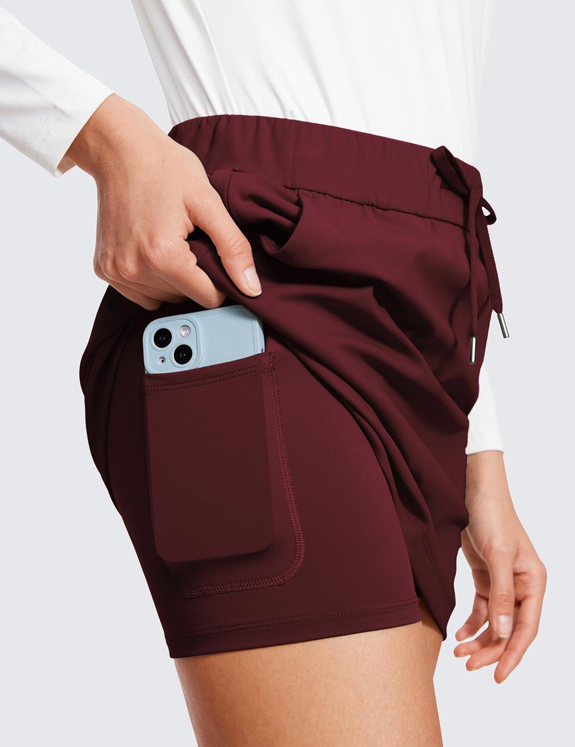 imageCRZ YOGA 4Way Stretch A Line Skirts for Women High Waitsted Mini Lined Tennis Work Drawstring Skort with PocketsNoctilucence Red