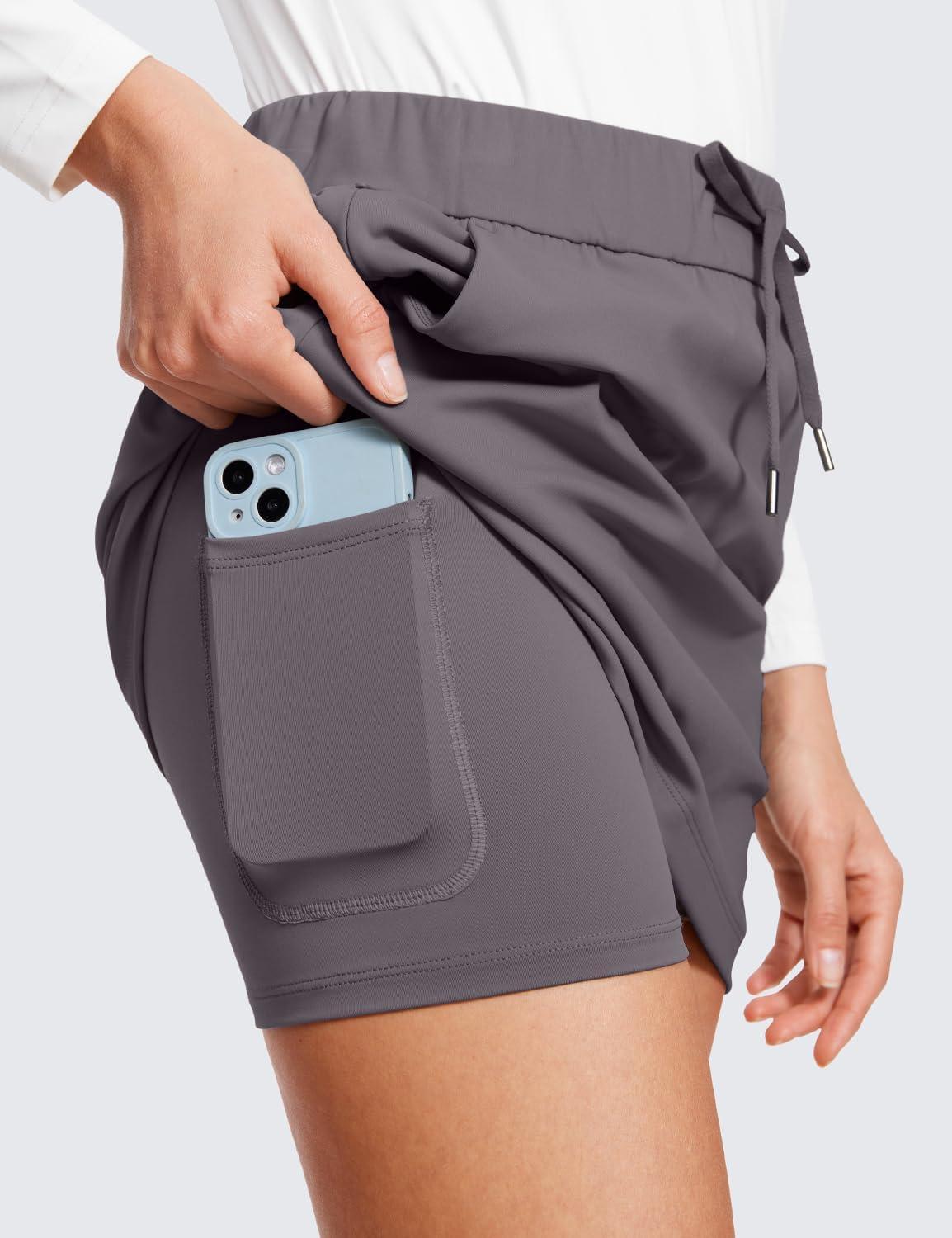 imageCRZ YOGA 4Way Stretch A Line Skirts for Women High Waitsted Mini Lined Tennis Work Drawstring Skort with PocketsTornado Grey