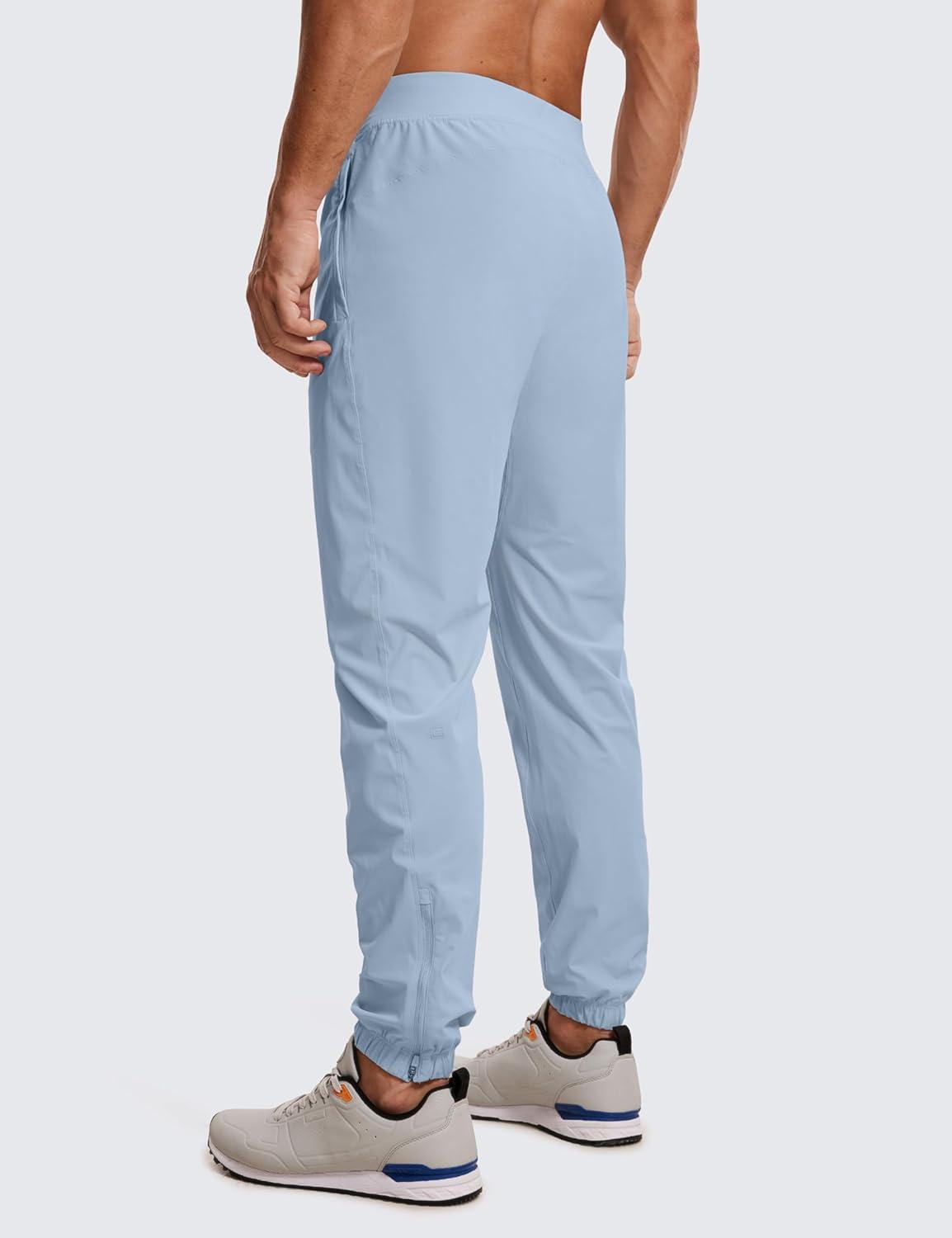 imageCRZ YOGA Athletic Joggers for Men 29quot Lightweight Running Training Pants with Zip Pockets and Ankle ZippersCambric Blue