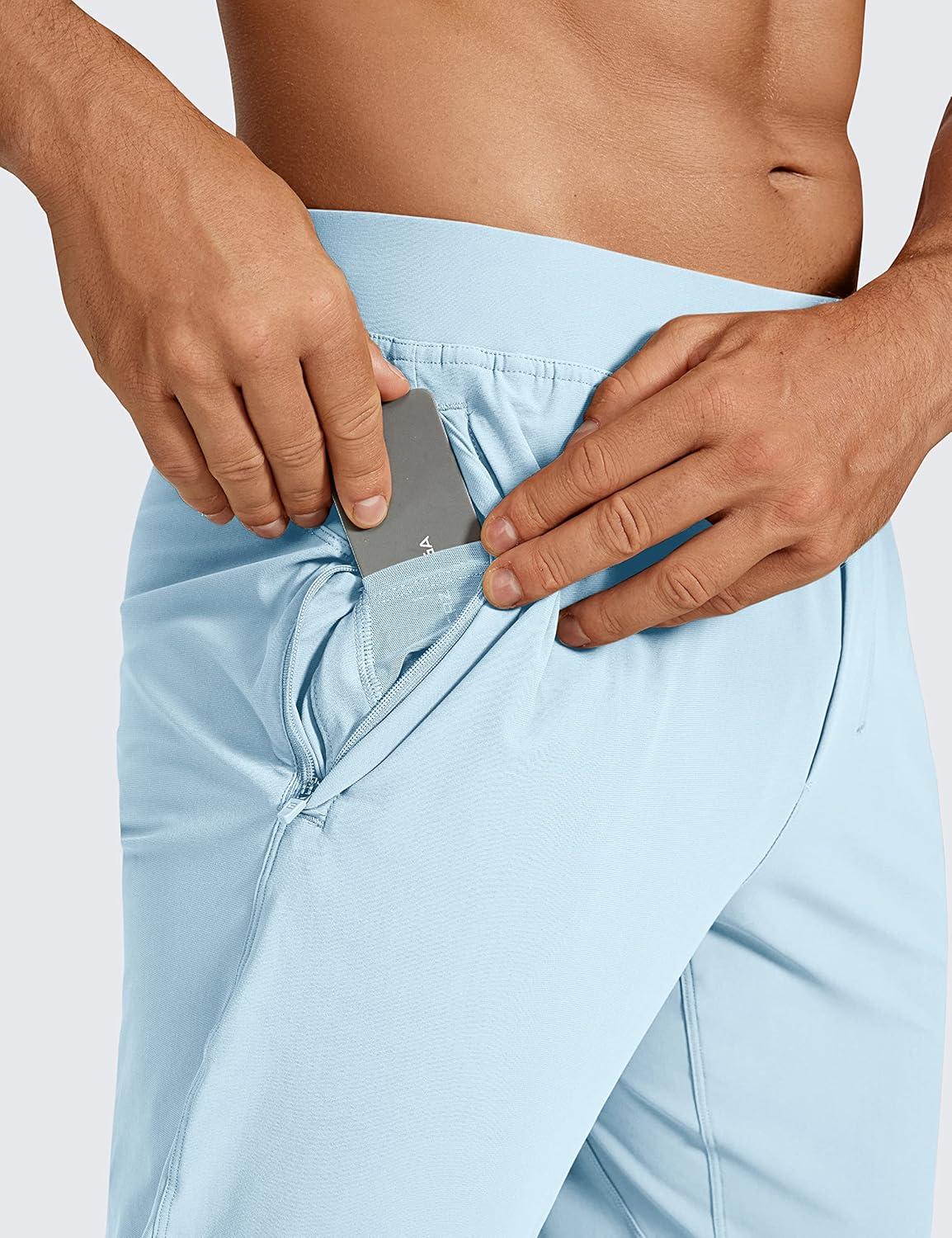 imageCRZ YOGA Athletic Joggers for Men 29quot Lightweight Running Training Pants with Zip Pockets and Ankle ZippersChambray Blue