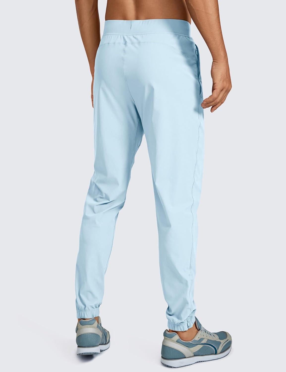 imageCRZ YOGA Athletic Joggers for Men 29quot Lightweight Running Training Pants with Zip Pockets and Ankle ZippersChambray Blue