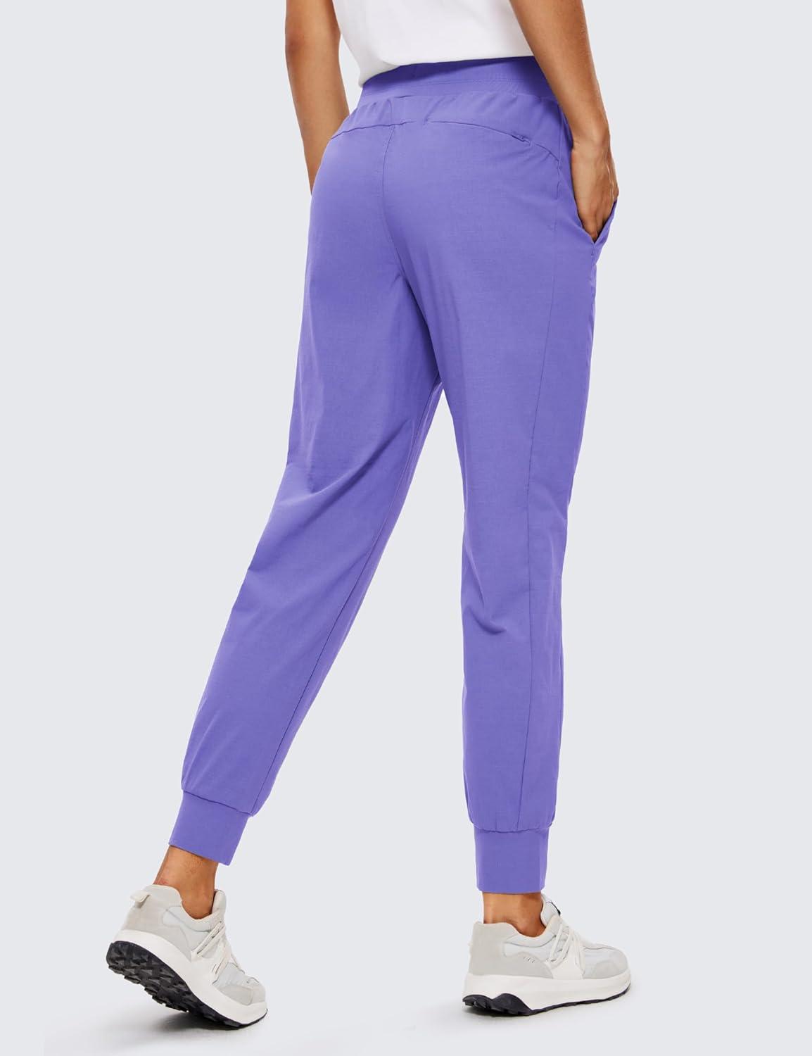 imageCRZ YOGA Athletic Joggers for Women 275quot Lightweight Travel Outdoor Hiking Pants with PocketsDark Lavender Purple