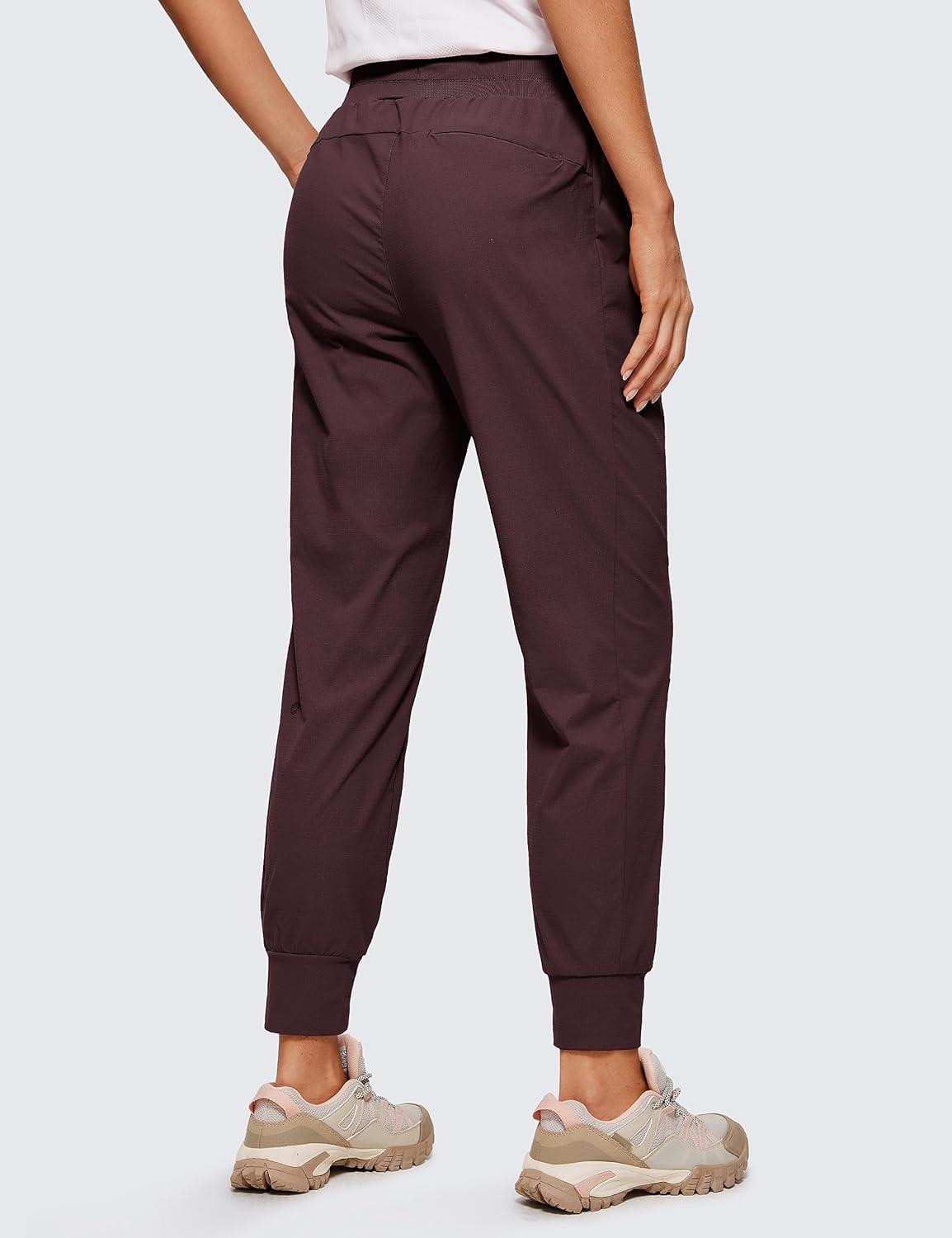 imageCRZ YOGA Athletic Joggers for Women 275quot Lightweight Travel Outdoor Hiking Pants with PocketsDark Russet