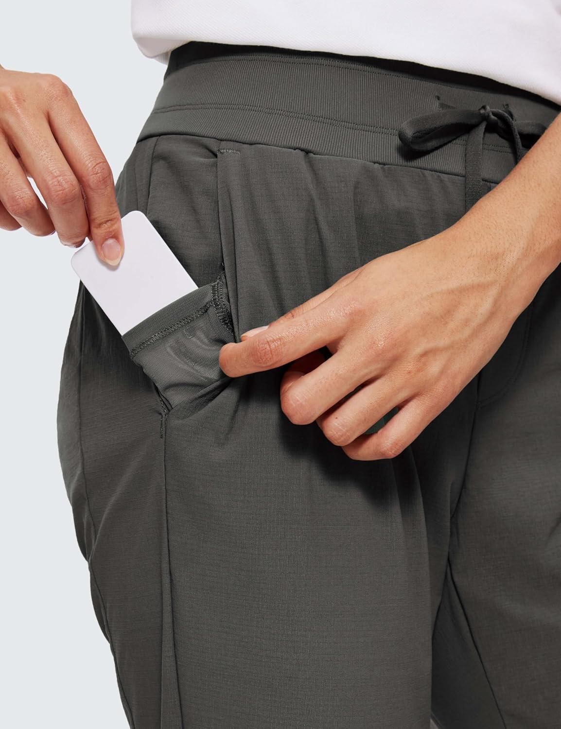 imageCRZ YOGA Athletic Joggers for Women 275quot Lightweight Travel Outdoor Hiking Pants with PocketsMountain Green