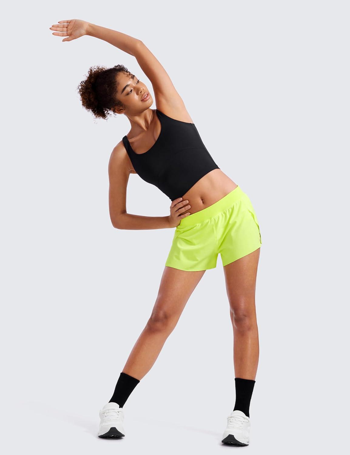 imageCRZ YOGA Athletic Running Shorts for Women V Split Low Waisted Lightweight Gym Workout Athletic Shorts with LinerNeon Yellow