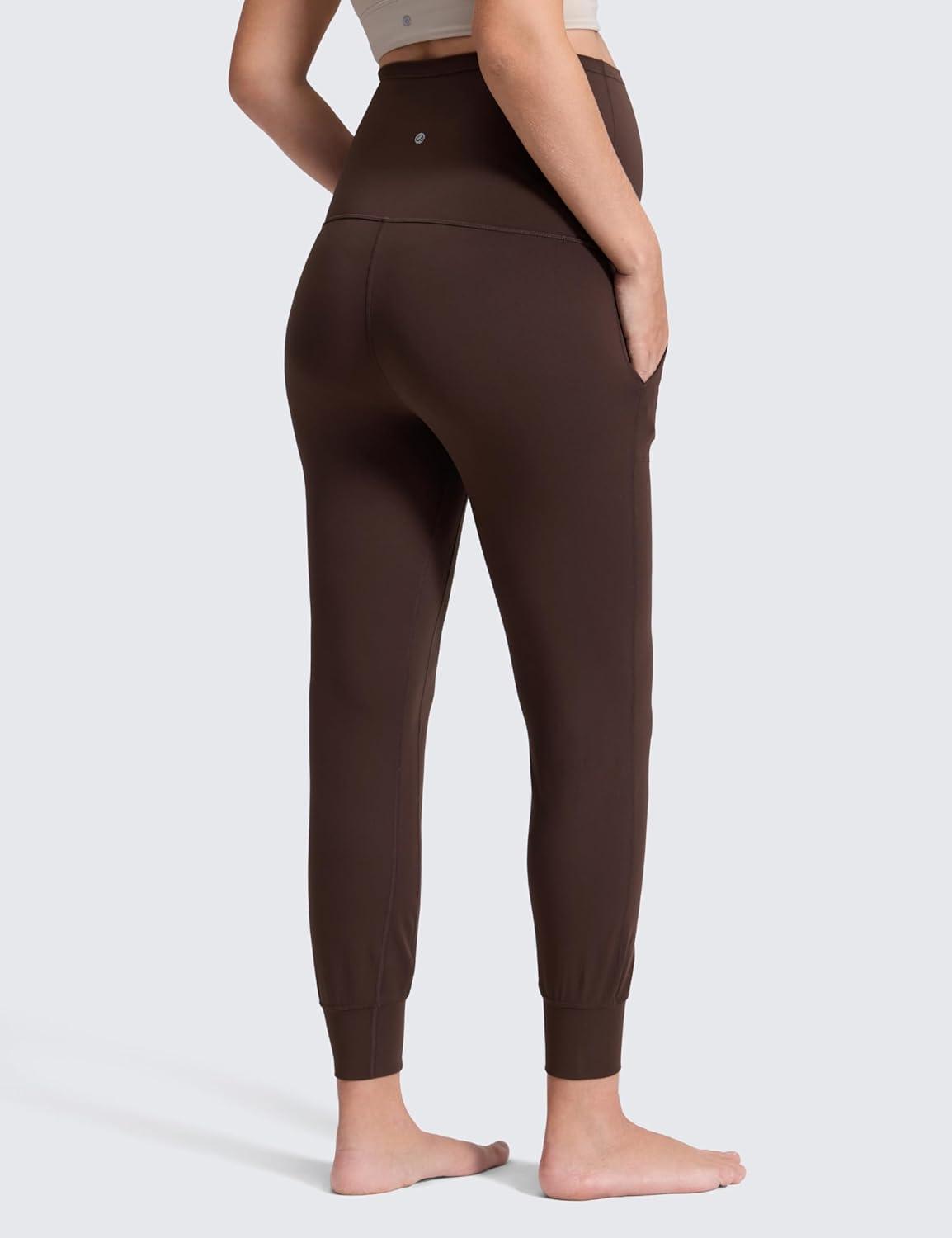 imageCRZ YOGA Butterluxe Maternity Joggers Pockets 27quot Workout Active Yoga Pregnancy Womens Pants Over The Belly SoftHot Fudge Brown