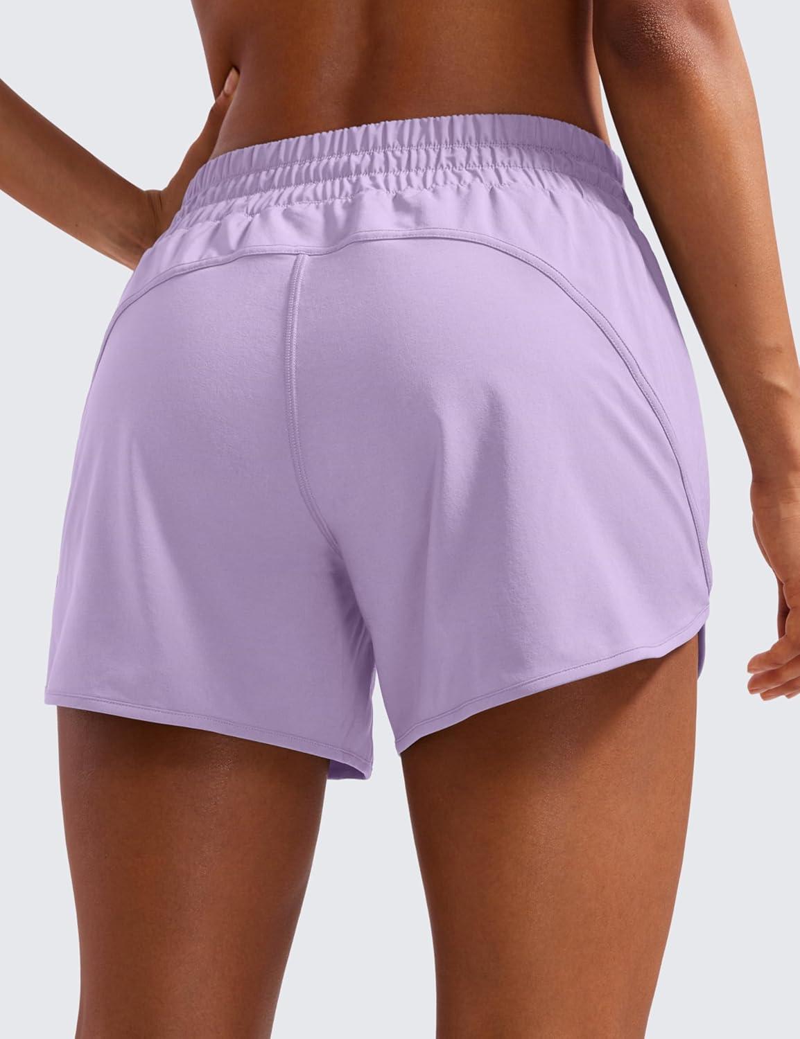 imageCRZ YOGA Dolphin Athletic Shorts for Women 5quot High Waisted Quick Dry for Running Workout Gym Track with Zip PocketLilac