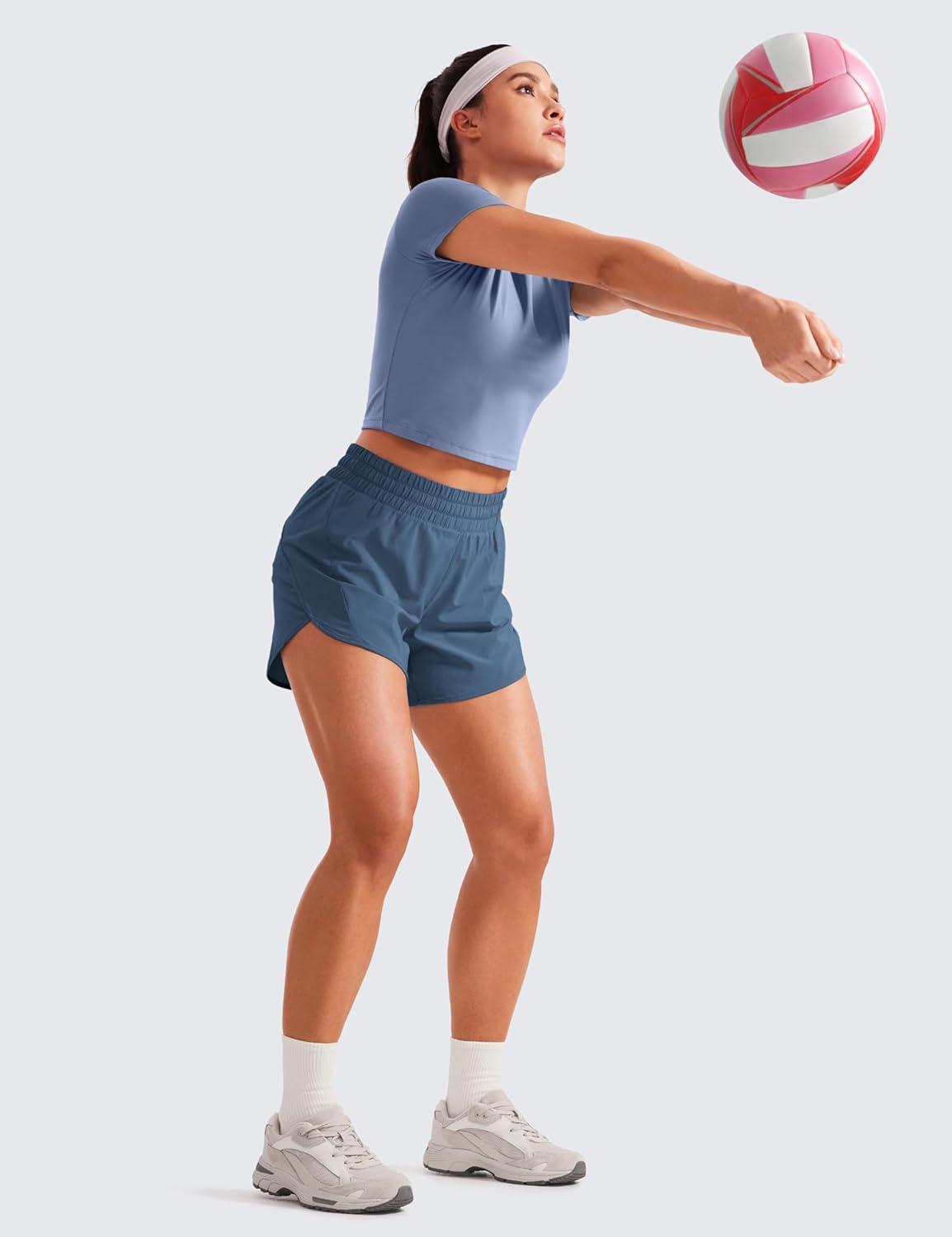 imageCRZ YOGA Dolphin Athletic Shorts for Women 5quot High Waisted Quick Dry for Running Workout Gym Track with Zip PocketStelindigo Blue