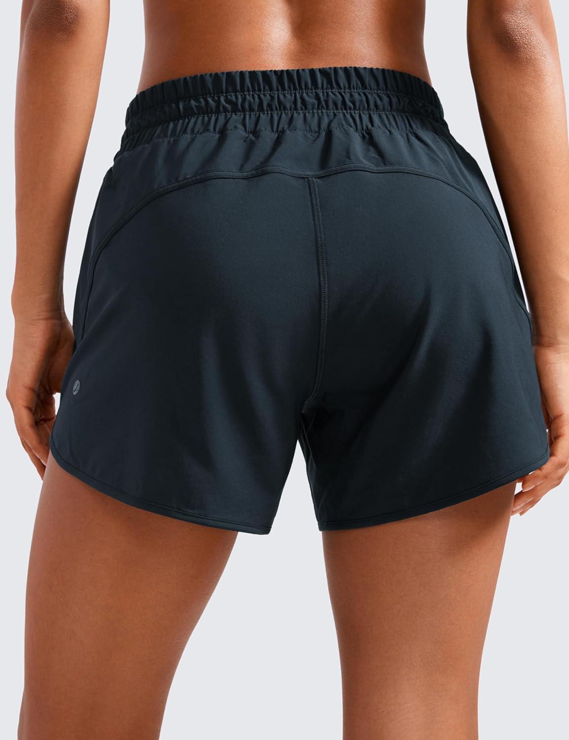 imageCRZ YOGA Dolphin Athletic Shorts for Women 5quot High Waisted Quick Dry for Running Workout Gym Track with Zip PocketTrue Navy