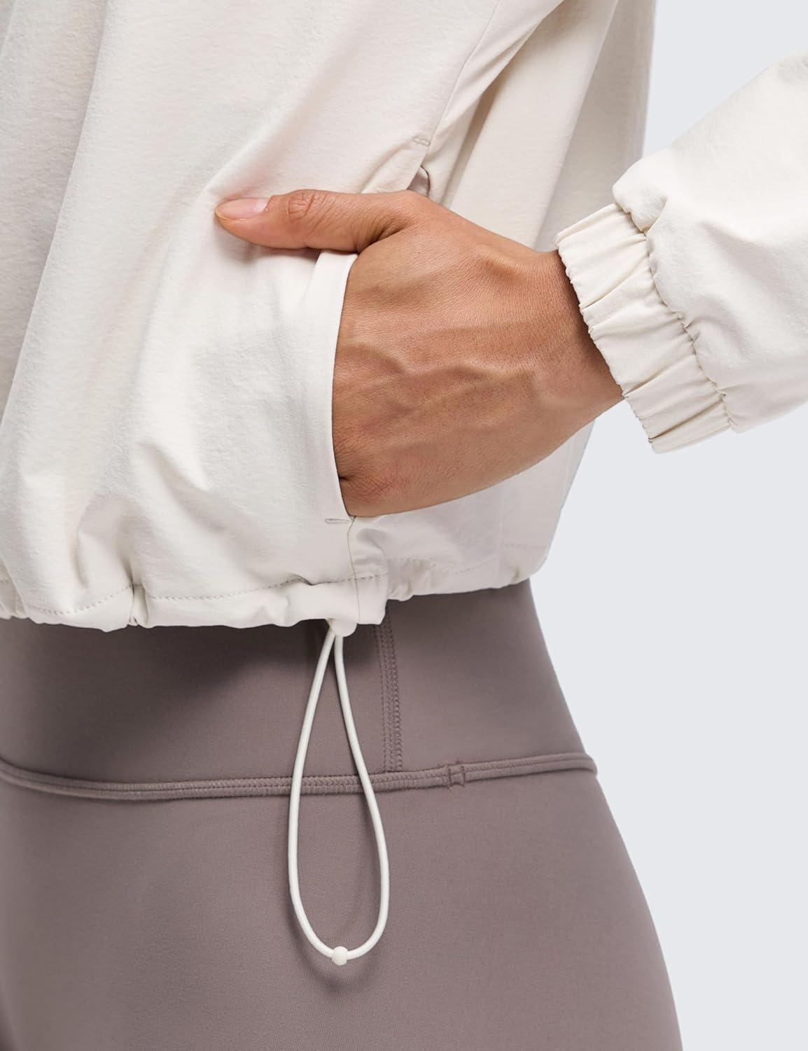 imageCRZ YOGA Drawstring Bottom Workout Jackets for Women Half Zip Pullover Cropped Workout Outdoor Tops with PocketsMilky White