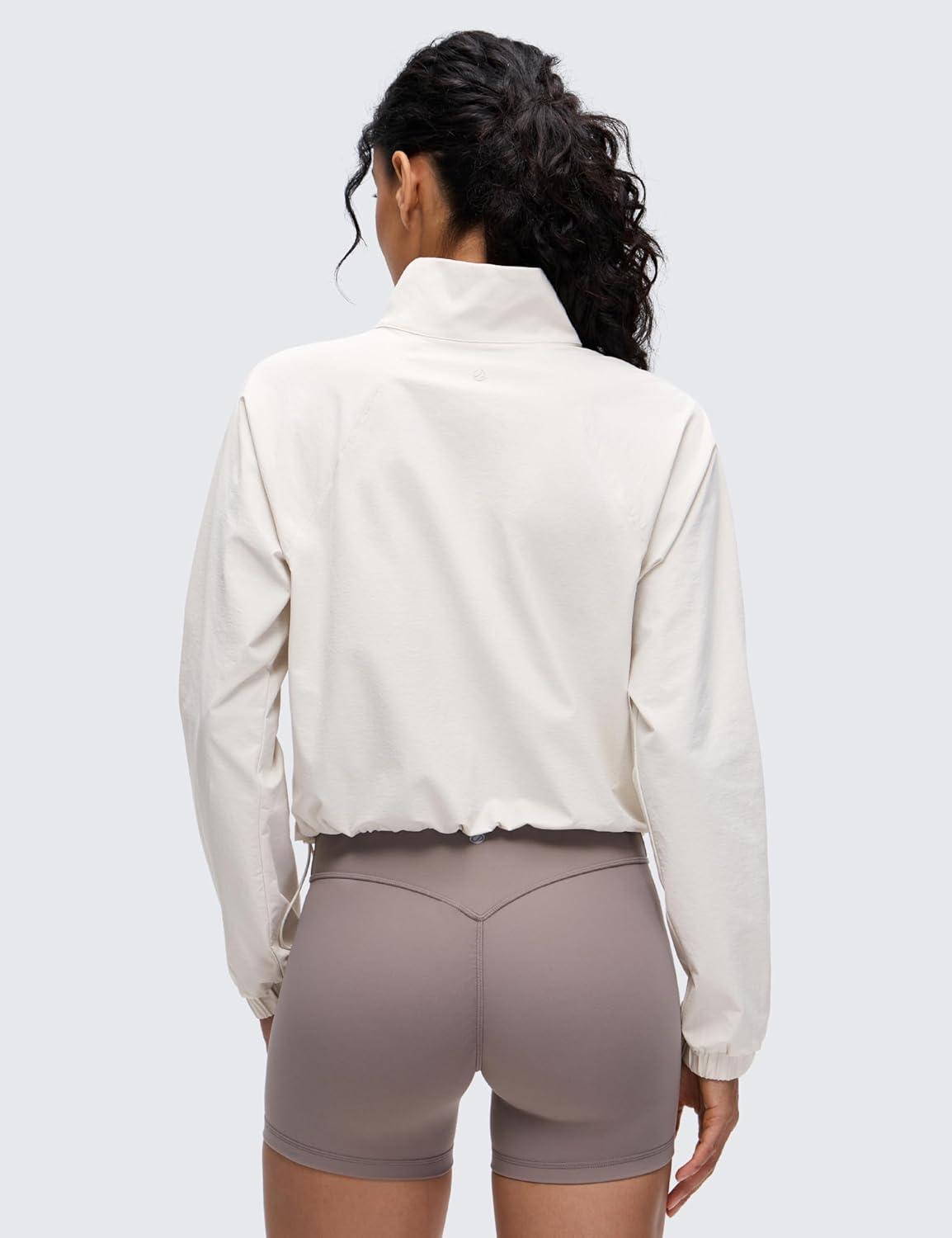 imageCRZ YOGA Drawstring Bottom Workout Jackets for Women Half Zip Pullover Cropped Workout Outdoor Tops with PocketsMilky White
