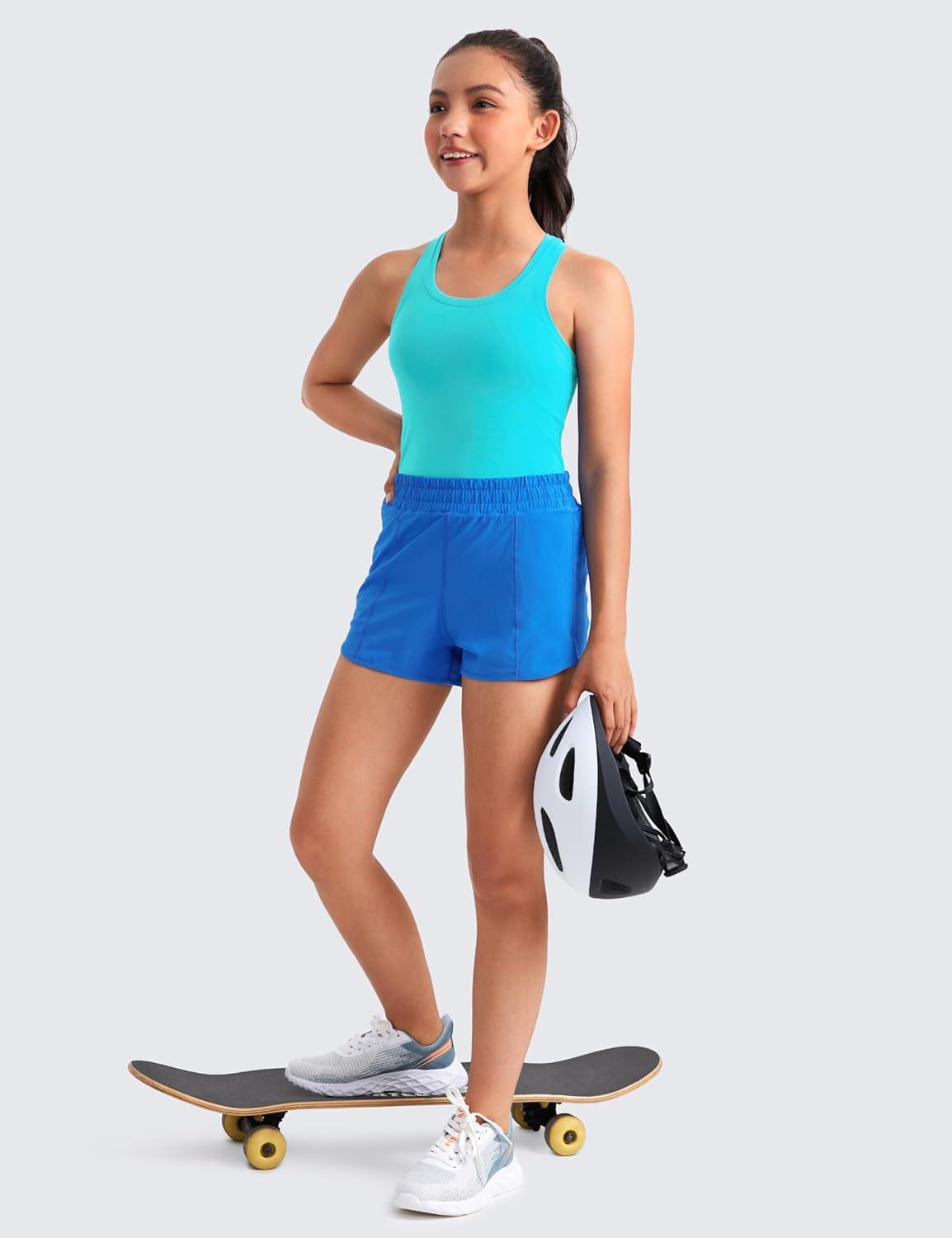 imageCRZ YOGA Girls Butterluxe Crew Neck Tank Tops Waist Length Dance Yoga Athletic Casual Racerback Tight Kids TeenSpectral Blue