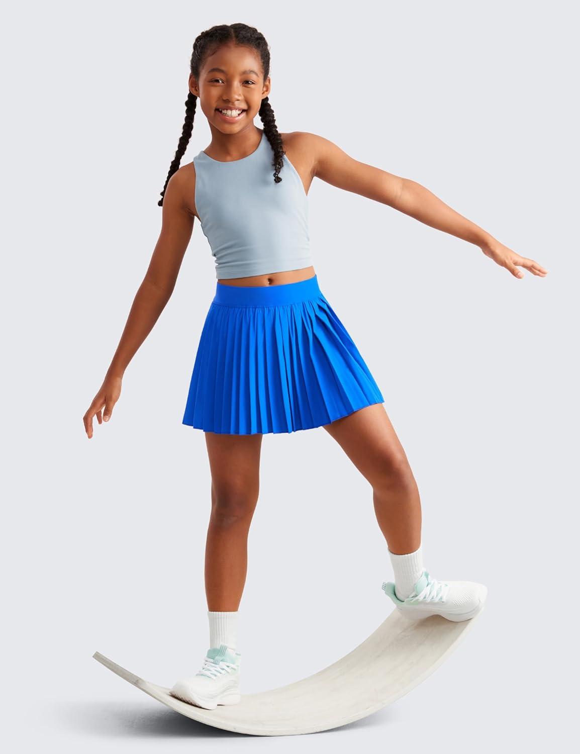 imageCRZ YOGA Girls FeatheryFit Soft Athletic Pleated Skirts Tennis School Casual Skorts with Pockets Liner Kids TeenSparkle Blue
