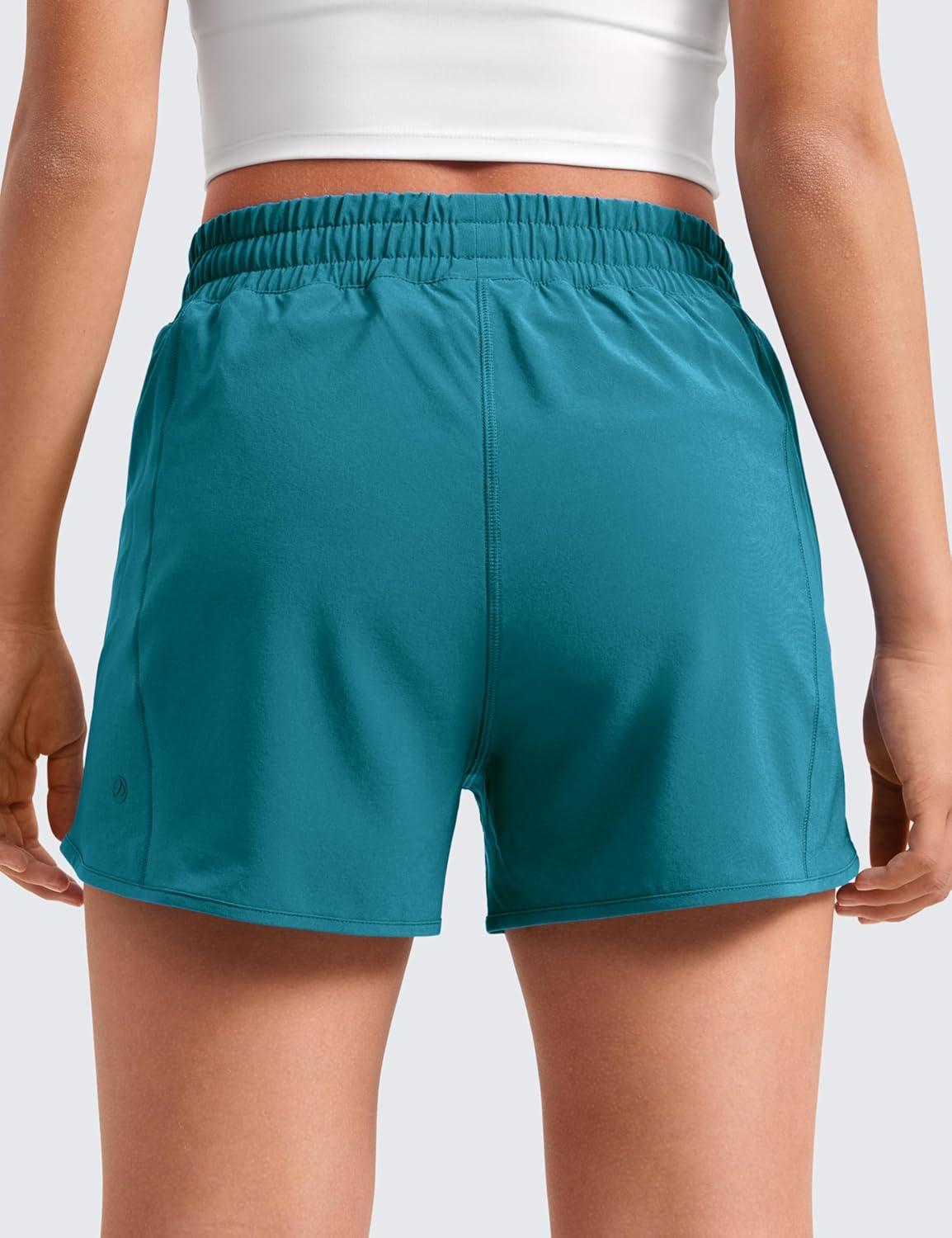 imageCRZ YOGA Girls FeatheryFit Soft Athletic Shorts with Zipper Pocket Tennis Soccer Running Casual Liner Kids TeenBorealis Green