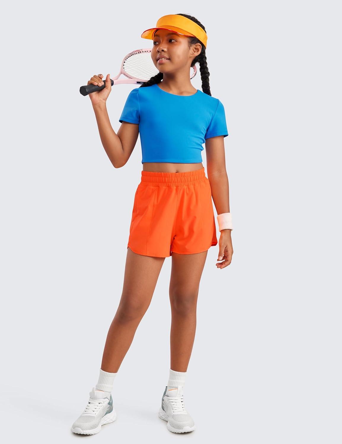 imageCRZ YOGA Girls FeatheryFit Soft Athletic Shorts with Zipper Pocket Tennis Soccer Running Casual Liner Kids TeenNeon Orange