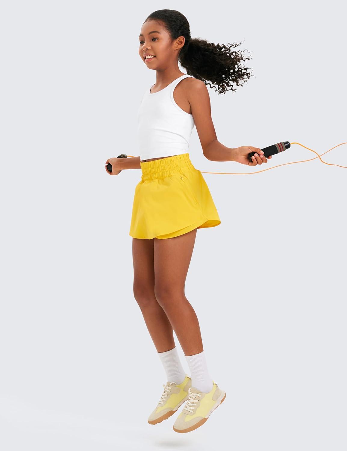 imageCRZ YOGA Girls FeatheryFit Soft Flowy Athletic Shorts Tennis Soccer Casual Ruffle Skirt Zip Pocket Liner Kids TeenHigh Visibility Yellow