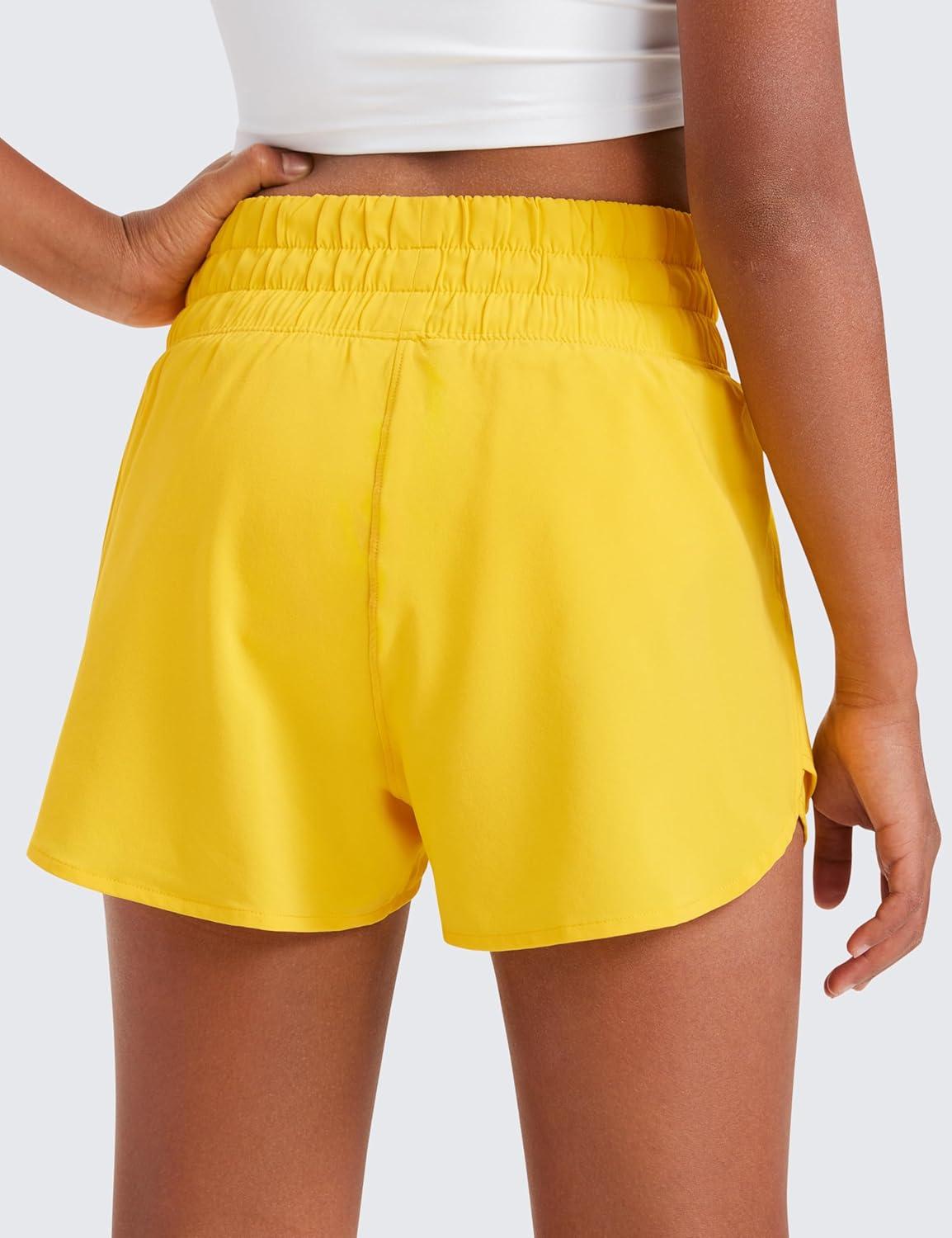 imageCRZ YOGA Girls FeatheryFit Soft Flowy Athletic Shorts Tennis Soccer Casual Ruffle Skirt Zip Pocket Liner Kids TeenHigh Visibility Yellow