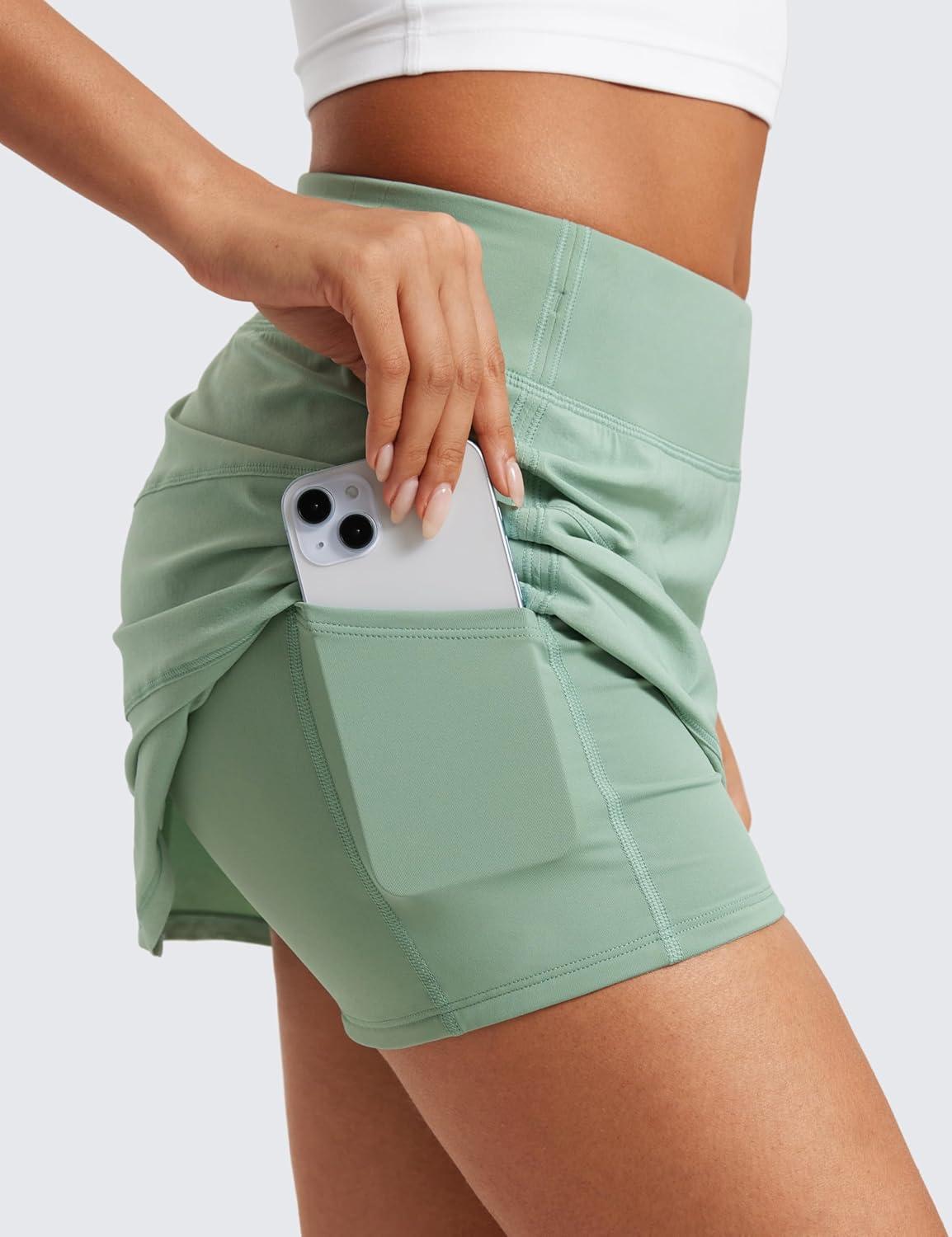 imageCRZ YOGA High Waisted A line Golf Skirts for Women Mini Lined Tennis Casual Work Skorts with 3 PocketsGreen Palm Court