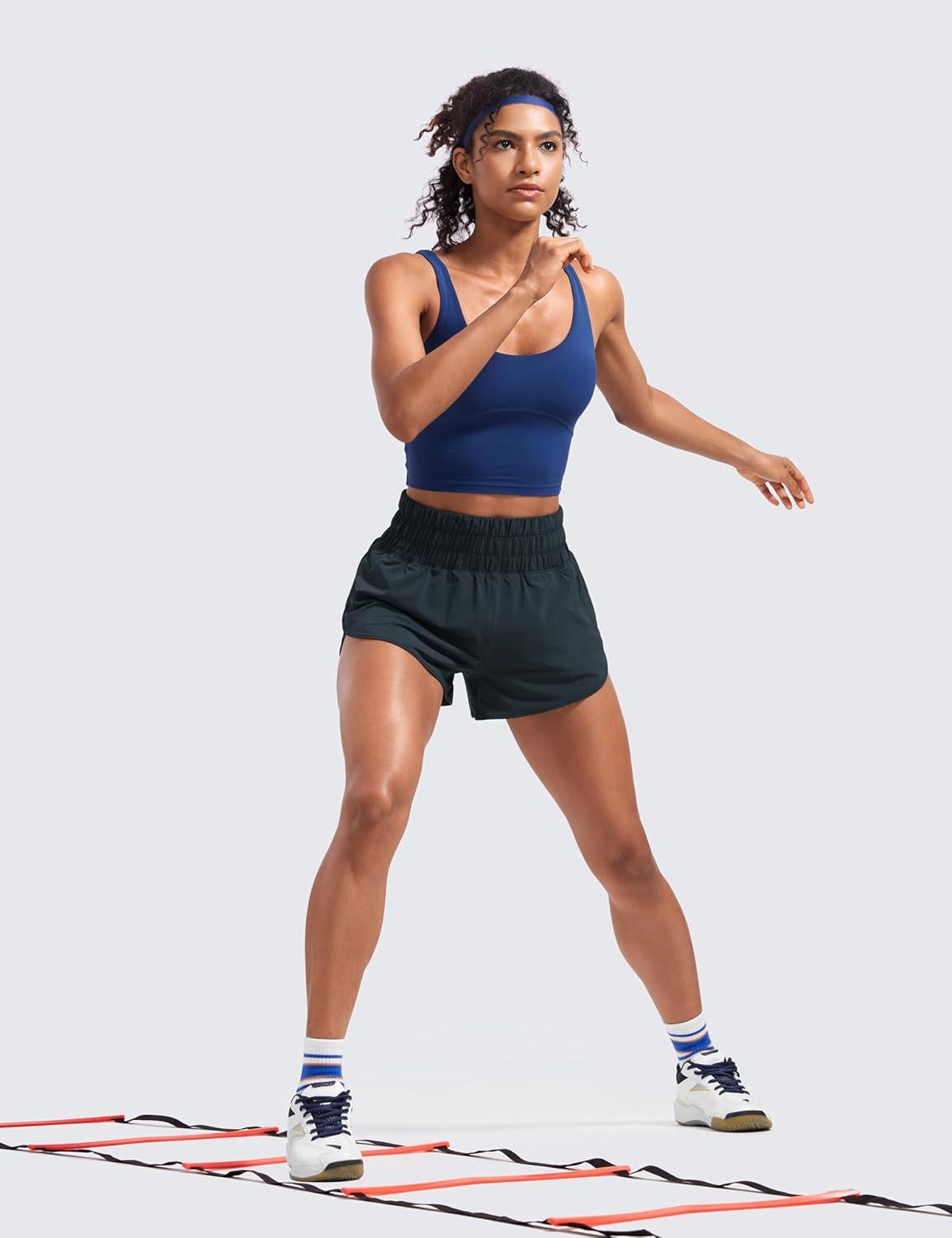 imageCRZ YOGA High Waisted Dolphin Running Shorts for Womens Mesh Liner for Gym Workout Athletic with Zipper PocketTrue Navy