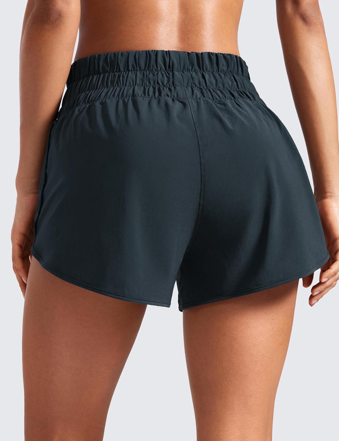 imageCRZ YOGA High Waisted Dolphin Running Shorts for Womens Mesh Liner for Gym Workout Athletic with Zipper PocketTrue Navy