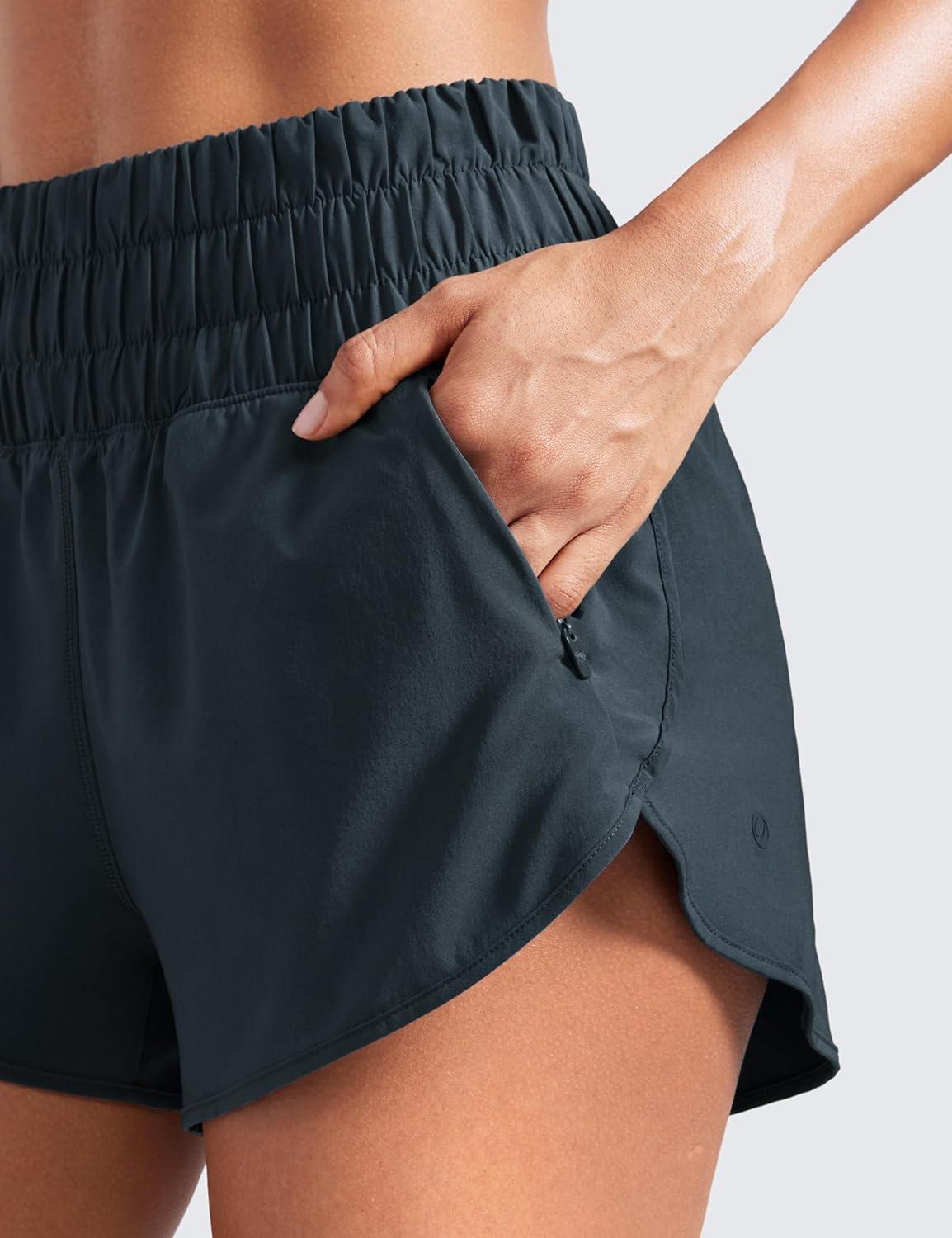 imageCRZ YOGA High Waisted Dolphin Running Shorts for Womens Mesh Liner for Gym Workout Athletic with Zipper PocketTrue Navy