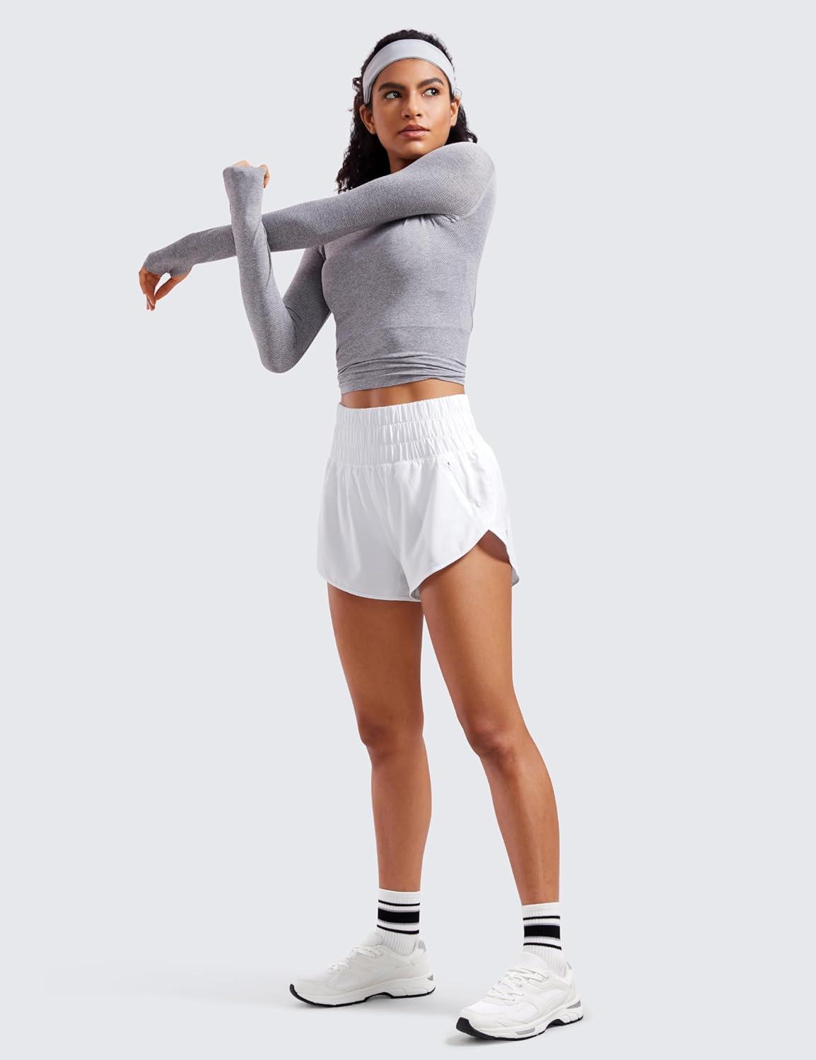 imageCRZ YOGA High Waisted Dolphin Running Shorts for Womens Mesh Liner for Gym Workout Athletic with Zipper PocketWhite