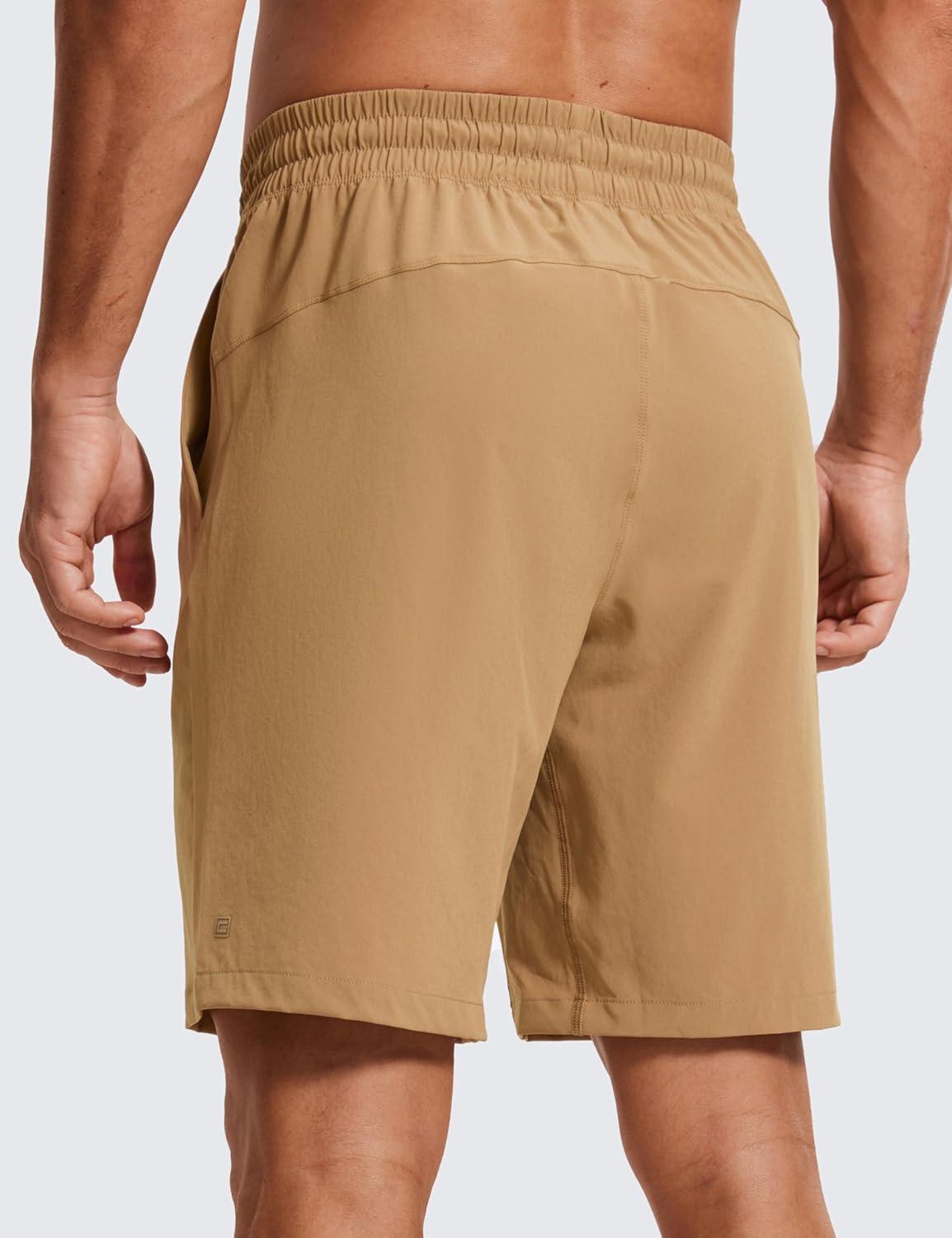 imageCRZ YOGA Mens Linerless Workout Shorts 9 Quick Dry for Running Sports Athletic Gym with PocketsKhaki Sand