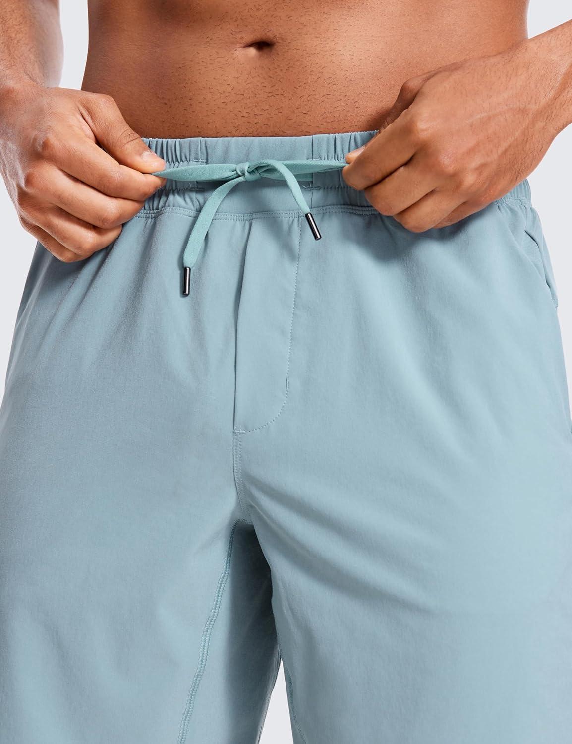 imageCRZ YOGA Mens Linerless Workout Shorts 9 Quick Dry for Running Sports Athletic Gym with PocketsLight Grayish Blue