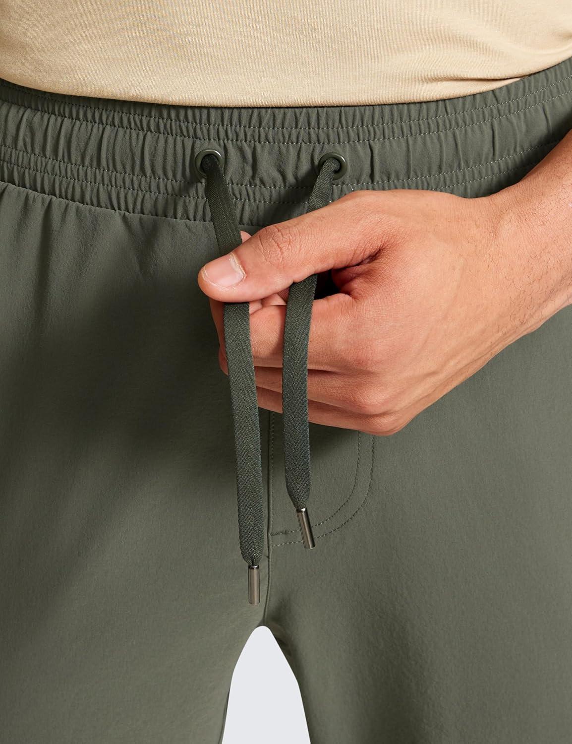 imageCRZ YOGA Stretch Workout Joggers for Men 29quot31quot Lightweight Water Resistant Outdoor Workout Pants with Zip PocketsLight Army Green