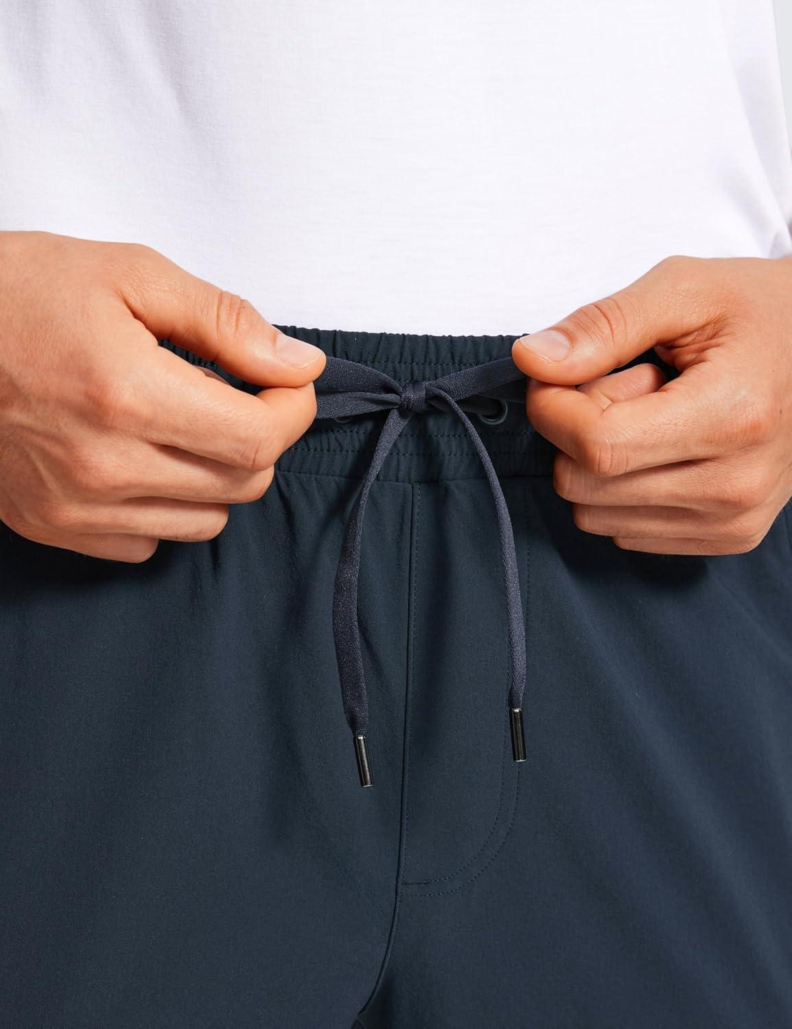 imageCRZ YOGA Stretch Workout Joggers for Men 29quot31quot Lightweight Water Resistant Outdoor Workout Pants with Zip PocketsTrue Navy