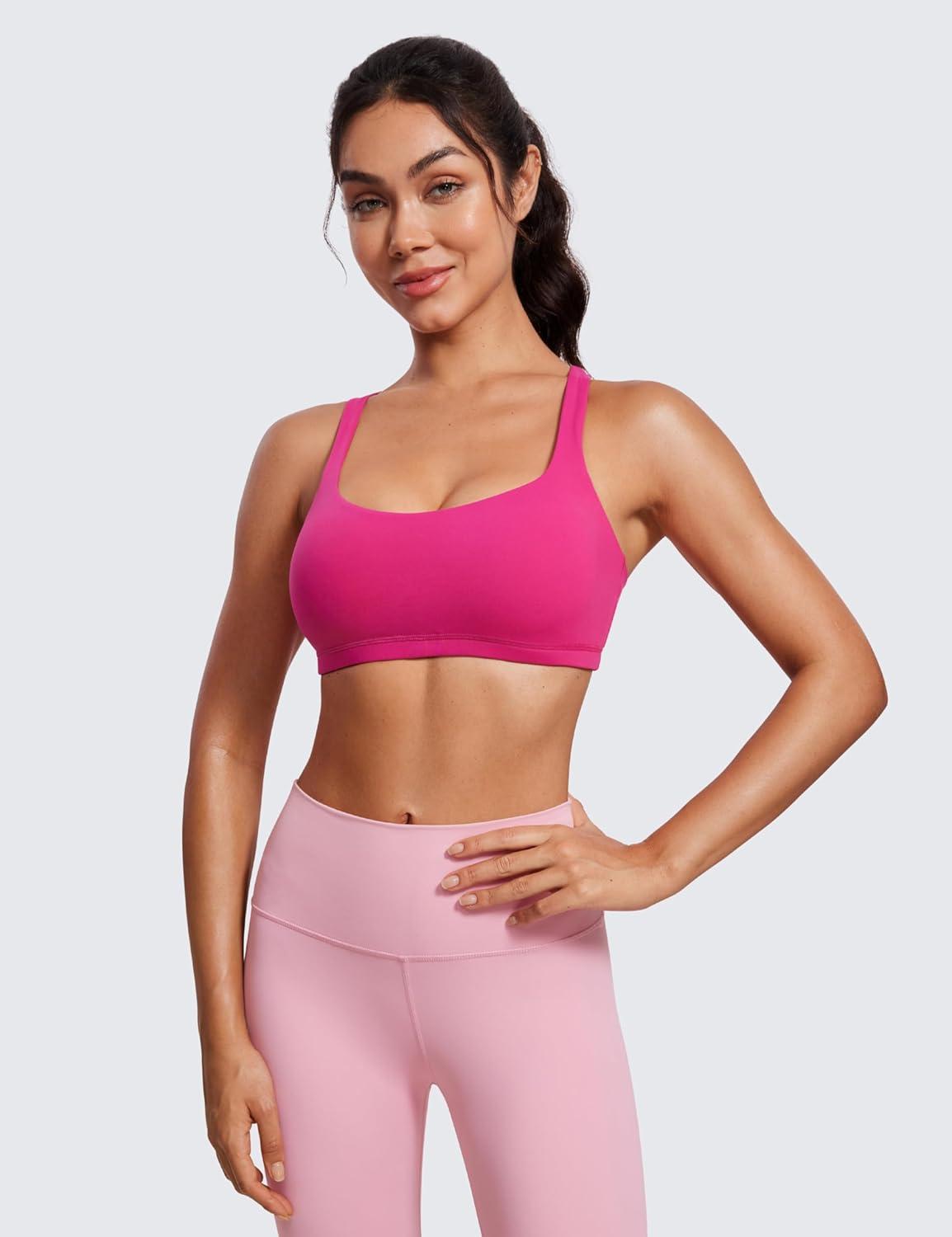 imageCRZ YOGA Womens Light Support Strappy Sports Bra Low Cut Wirefree Padded Yoga Cami Criss Cross BackGranita Pink