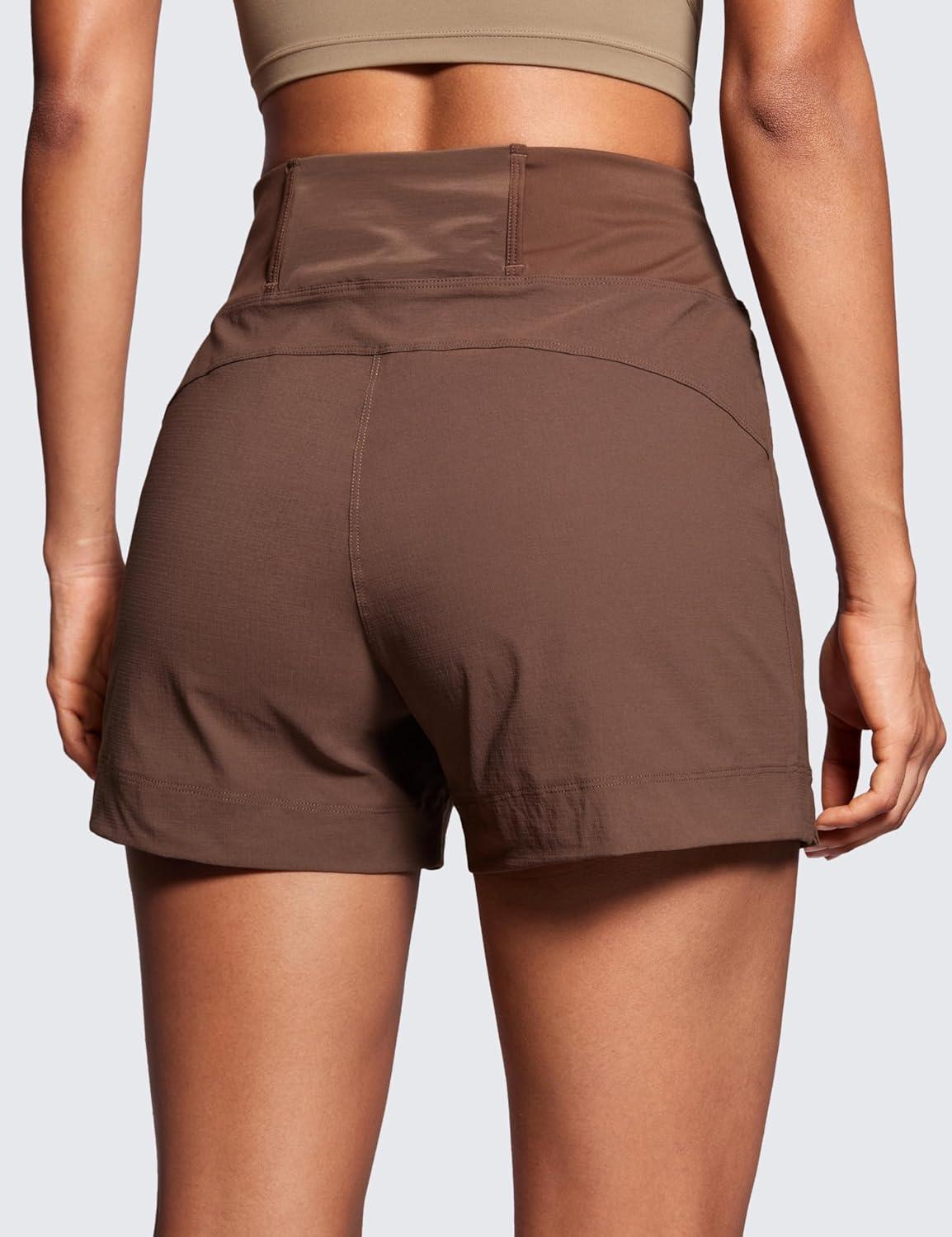 imageCRZ YOGA Womens Lightweight Mid Rise Hiking Shorts 4 Stretch for Athletic Summer Travel Outdoor Golf with Zip PocketsCoffee Brown