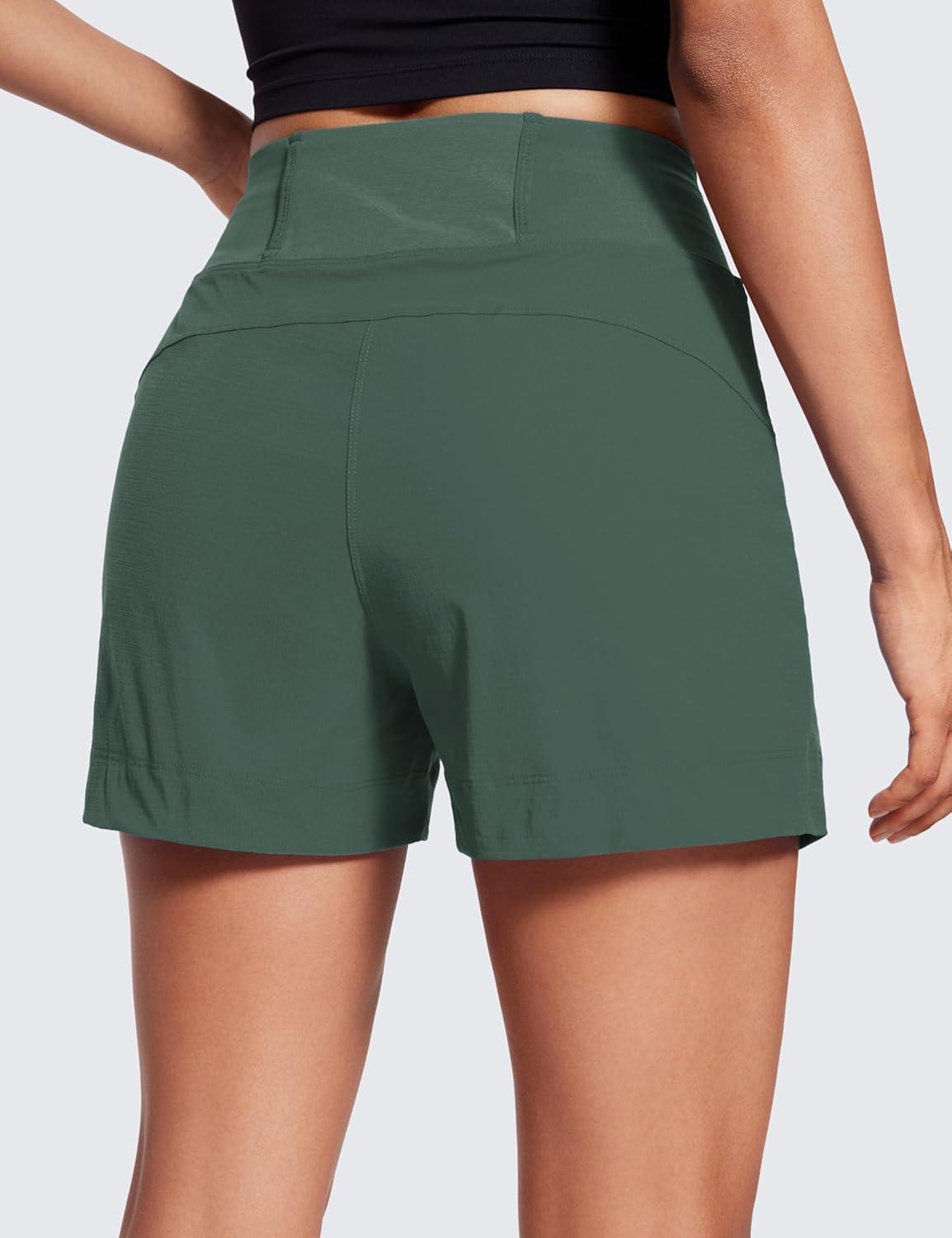 imageCRZ YOGA Womens Lightweight Mid Rise Hiking Shorts 4 Stretch for Athletic Summer Travel Outdoor Golf with Zip PocketsDark Forest Green