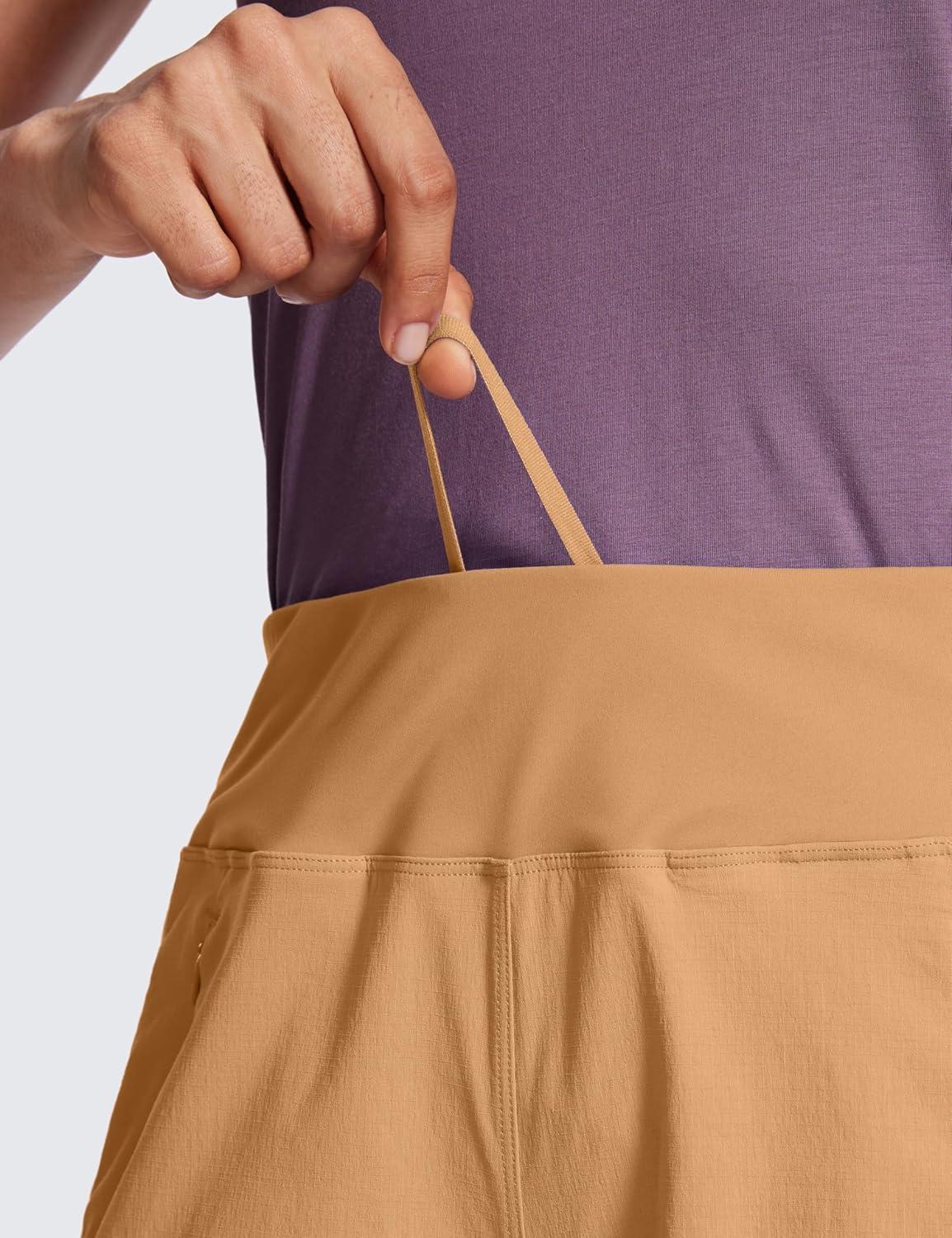 imageCRZ YOGA Womens Lightweight Mid Rise Hiking Shorts 4 Stretch for Athletic Summer Travel Outdoor Golf with Zip PocketsDoe Brown