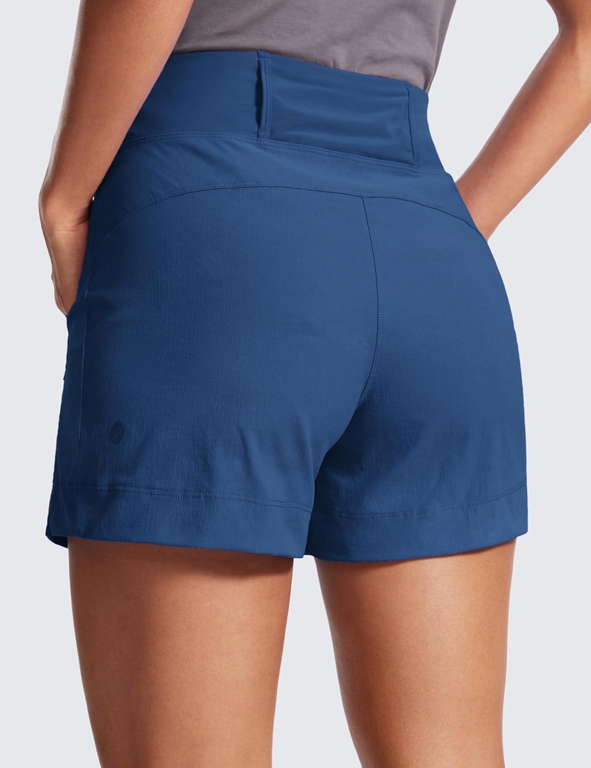 imageCRZ YOGA Womens Lightweight Mid Rise Hiking Shorts 4 Stretch for Athletic Summer Travel Outdoor Golf with Zip PocketsPitch Blue
