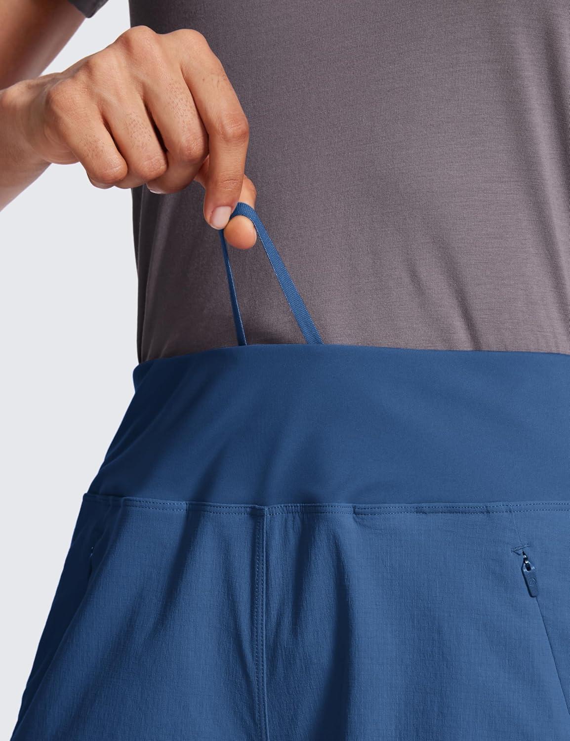 imageCRZ YOGA Womens Lightweight Mid Rise Hiking Shorts 4 Stretch for Athletic Summer Travel Outdoor Golf with Zip PocketsPitch Blue