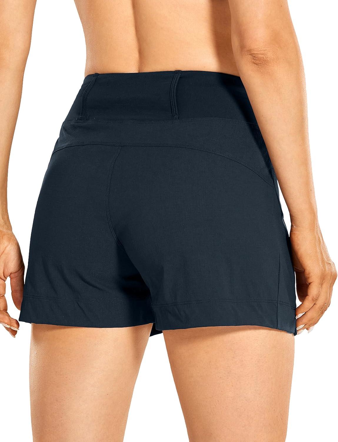 imageCRZ YOGA Womens Lightweight Mid Rise Hiking Shorts 4 Stretch for Athletic Summer Travel Outdoor Golf with Zip PocketsTrue Navy