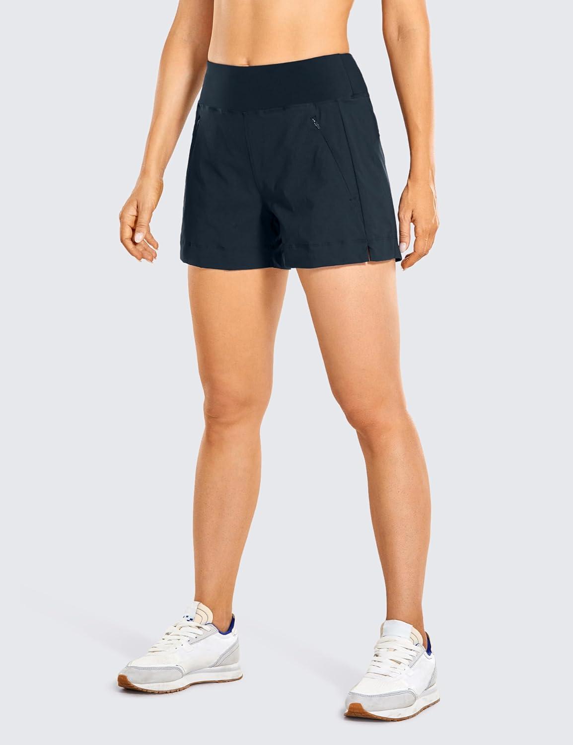 imageCRZ YOGA Womens Lightweight Mid Rise Hiking Shorts 4 Stretch for Athletic Summer Travel Outdoor Golf with Zip PocketsTrue Navy