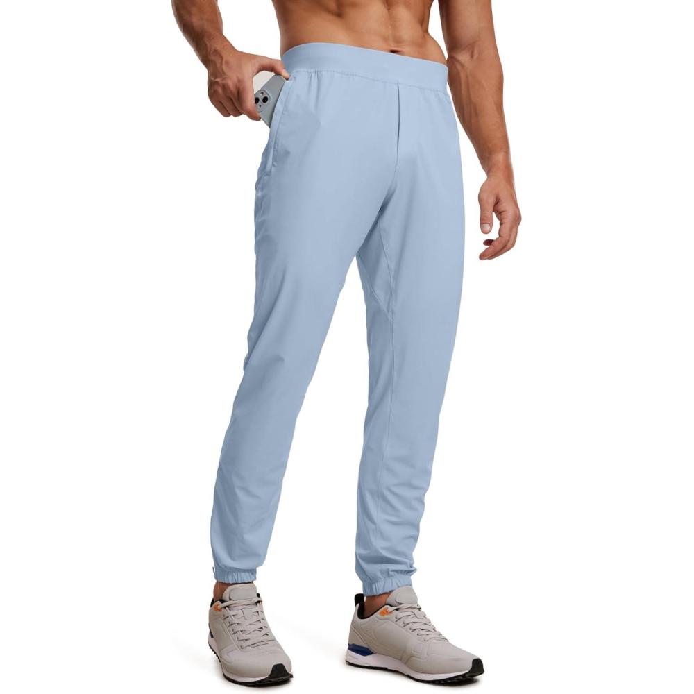 imageCRZ YOGA Athletic Joggers for Men 29quot Lightweight Running Training Pants with Zip Pockets and Ankle ZippersCambric Blue