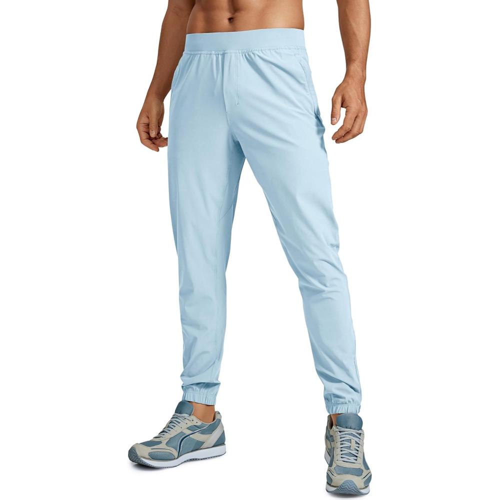 imageCRZ YOGA Athletic Joggers for Men 29quot Lightweight Running Training Pants with Zip Pockets and Ankle ZippersChambray Blue