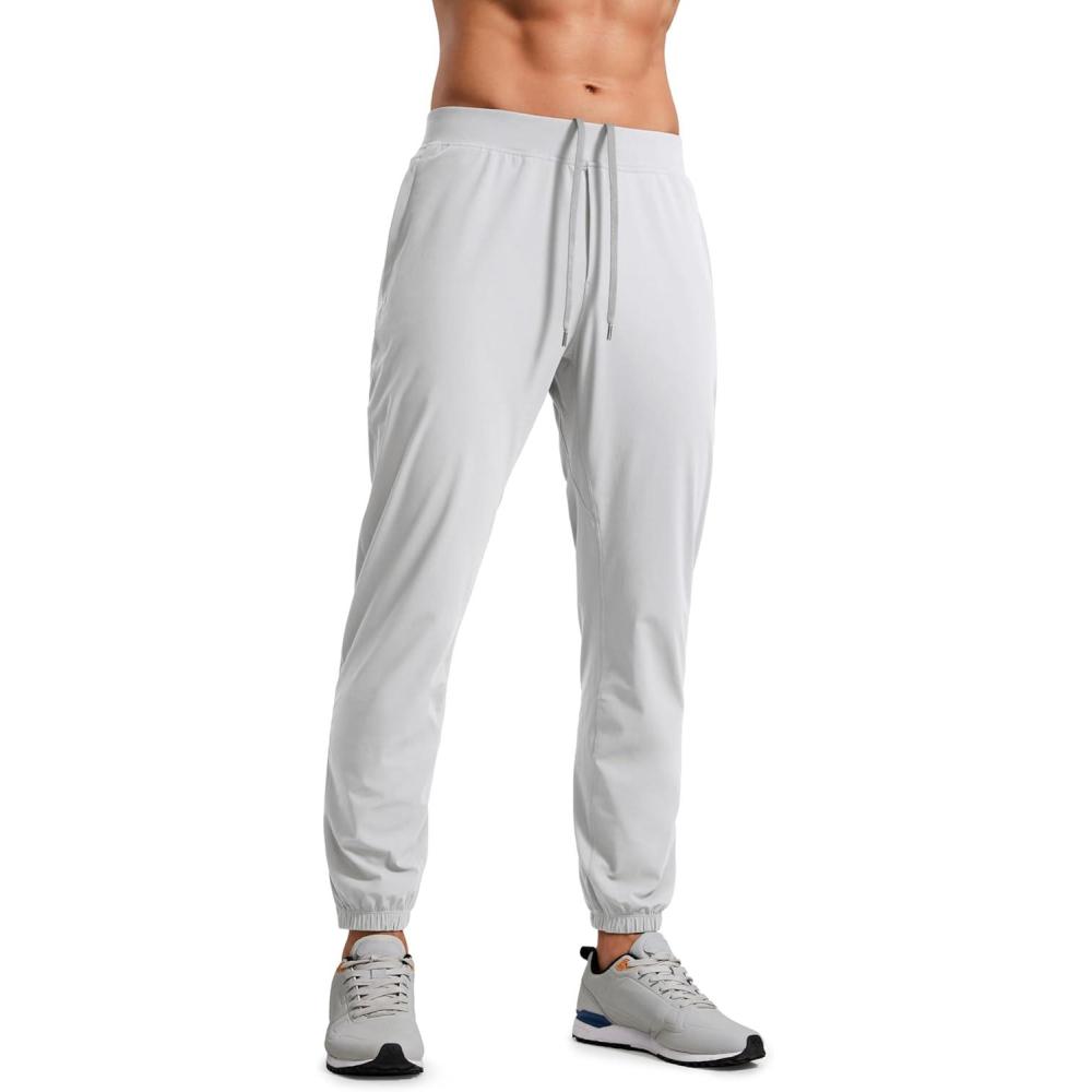 imageCRZ YOGA Athletic Joggers for Men 29quot Lightweight Running Training Pants with Zip Pockets and Ankle ZippersPlatinum Grey