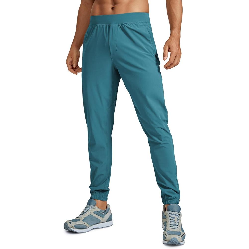 imageCRZ YOGA Athletic Joggers for Men 29quot Lightweight Running Training Pants with Zip Pockets and Ankle ZippersWashed Blue