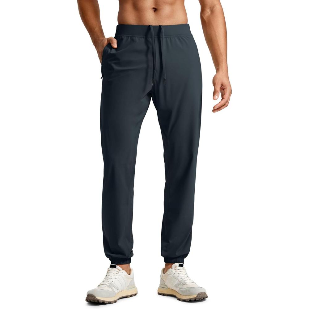 imageCRZ YOGA Athletic Joggers for Men 31quot Lightweight Running Training Pants with Zip Pockets and Ankle ZippersTrue Navy