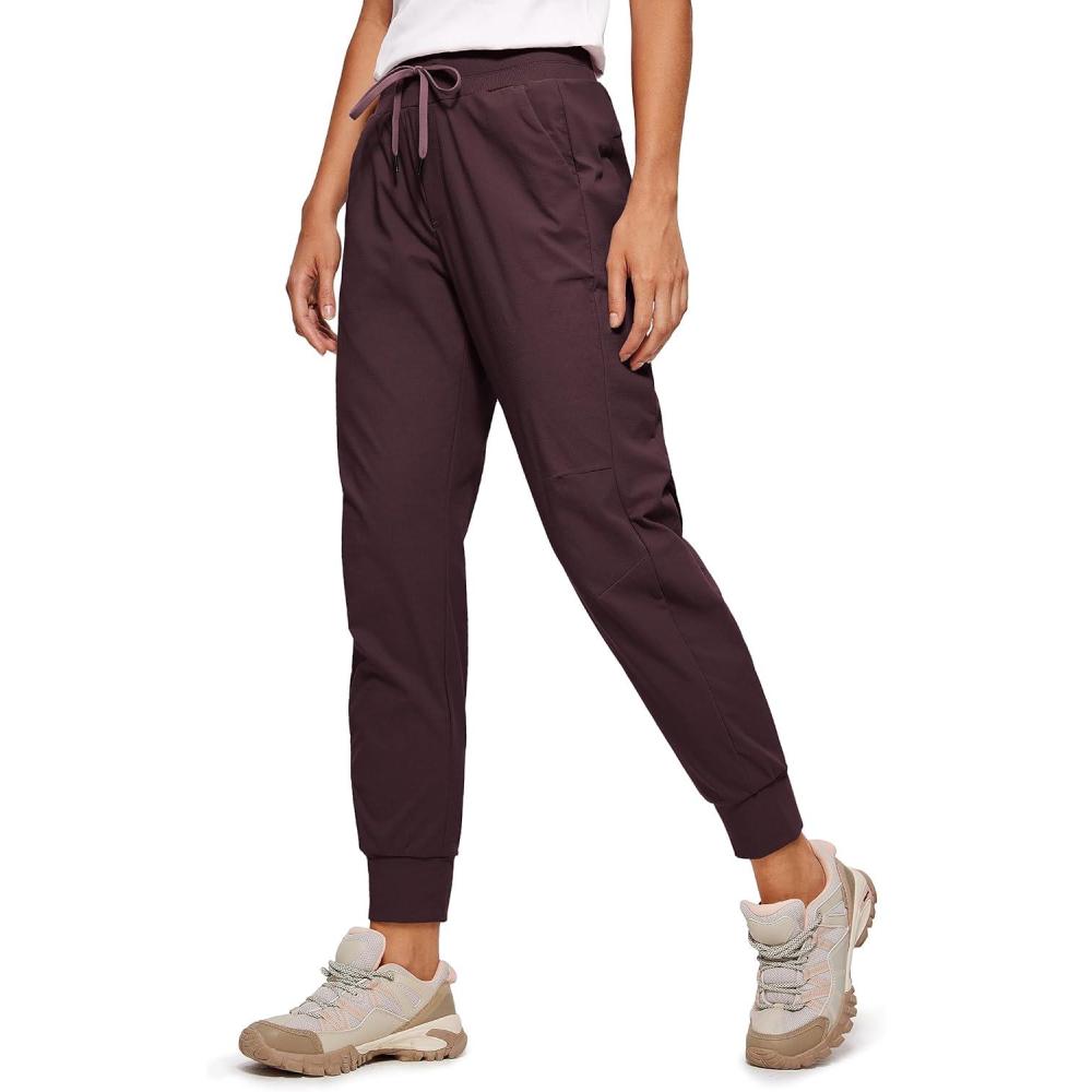imageCRZ YOGA Athletic Joggers for Women 275quot Lightweight Travel Outdoor Hiking Pants with PocketsDark Russet