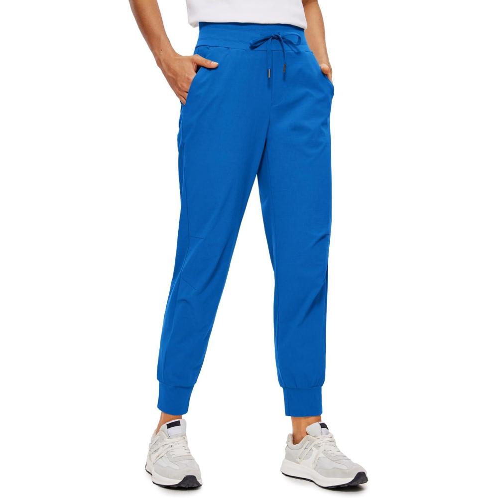 imageCRZ YOGA Athletic Joggers for Women 275quot Lightweight Travel Outdoor Hiking Pants with PocketsSparkle Blue