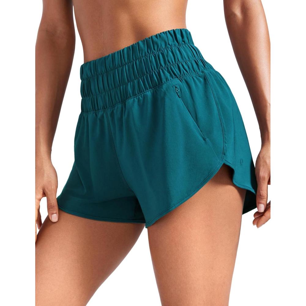 imageCRZ YOGA High Waisted Dolphin Running Shorts for Womens Mesh Liner for Gym Workout Athletic with Zipper PocketBorealis Green