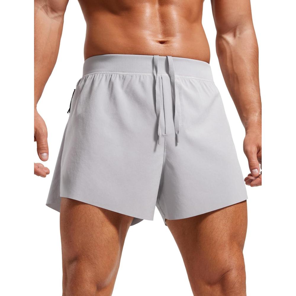 imageCRZ YOGA Mens Side Split Running Shorts 4 Quick Dry for Athletic Gym Workout with Zip Pocket and Brief LinerGull Gray