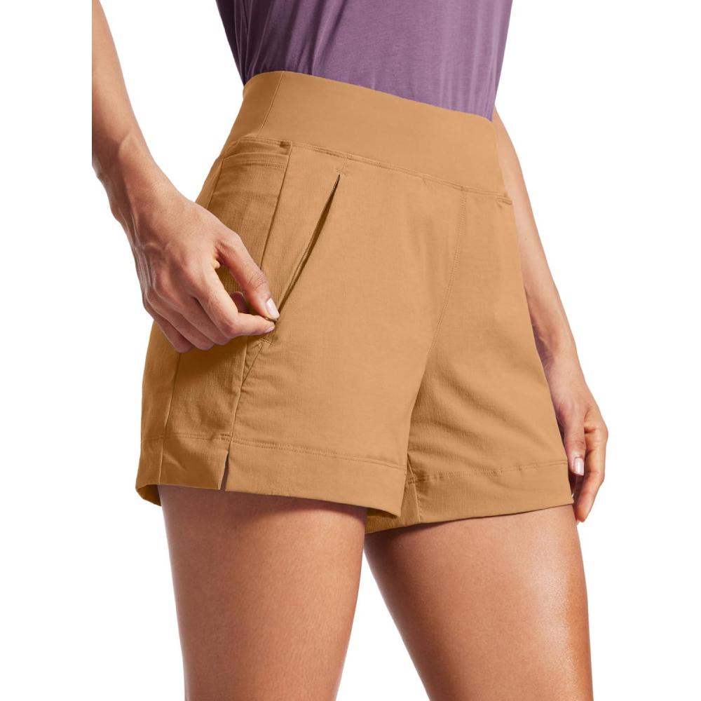 imageCRZ YOGA Womens Lightweight Mid Rise Hiking Shorts 4 Stretch for Athletic Summer Travel Outdoor Golf with Zip PocketsDoe Brown