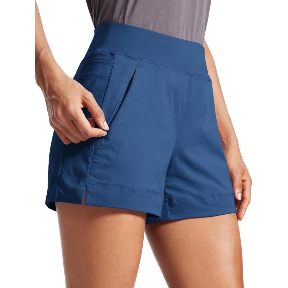 imageCRZ YOGA Womens Lightweight Mid Rise Hiking Shorts 4  Stretch for Athletic Summer Travel Outdoor Golf with Zip PocketsPitch Blue